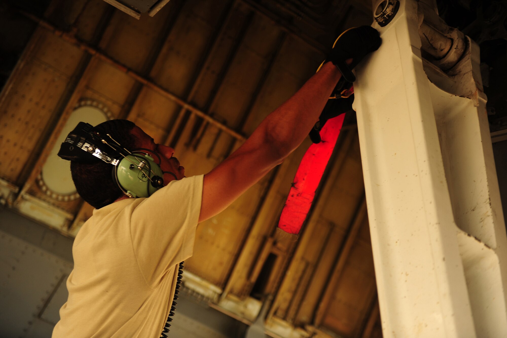 WESTERN EUROPE (April 5, 2011) -- Staff Sgt. Taurean Singleton, 161st Air Refueling Wing, Arizona Air National Guard, installs a landing gear door lock on the wheel well of a KC-135 Stratotanker on April 5. The door lock ensures the safety of maintenance crews working on the aircraft. The KC-135 returned from a refueling mission supporting Operation Unified Protector. The 313th AEW supports Operation Unified Protector, a NATO-led mission in Libya to protect civilian and civilian-populated areas under threat of attack. The 313th AEW provides Aerial Refueling to U.S. and coalition aircraft with KC-135 Stratotankers and KC-10 Extenders.  (U.S. Air Force Photo by Senior Airman Tyler Placie)