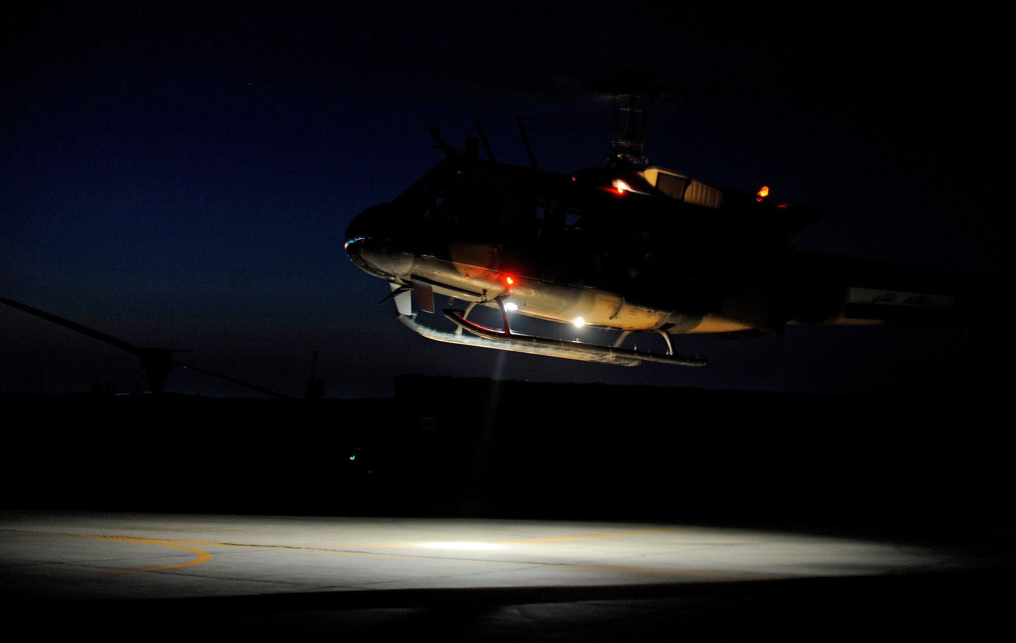 CAMP TAJI, Iraq -- An Iraqi Army Aviation Command UH-1 Huey takes off for the last airborne U.S advisory mission March 15. After more than five years advising and training alongside Iraqi pilots in the cockpit, U.S. pilots now advise their Iraqi partners on strategic issues concerning the fleet of 16 Huey helicopters assigned here. (U.S. Air Force/Tech. Sgt. Jason Lake)