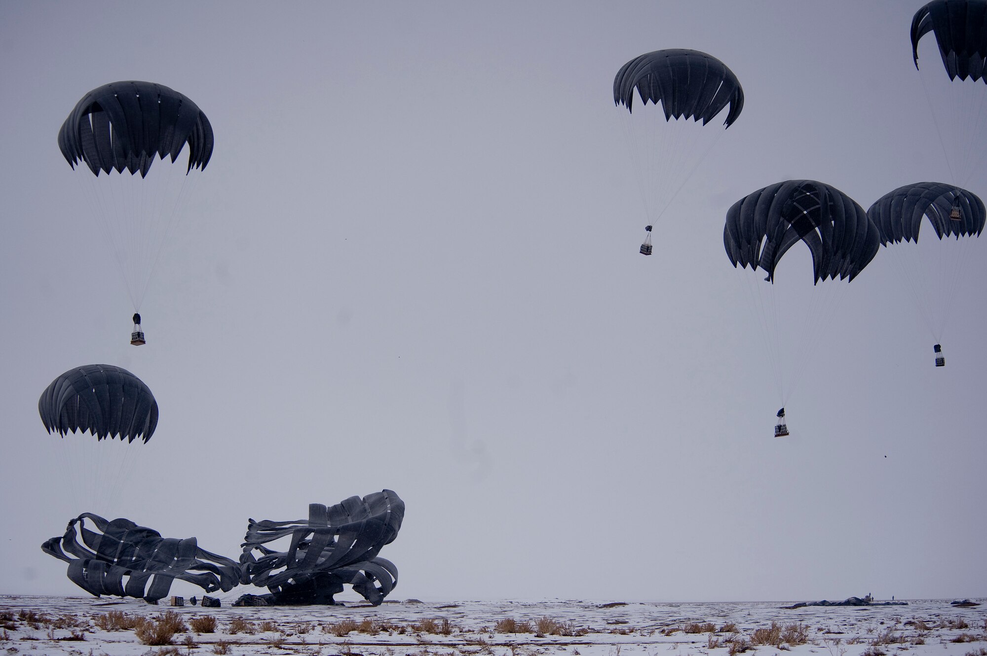 Bundles of fuel are air delivered to Forward Operating Base Waza K'wah in the Paktika province of Afghanistan. The fuel was part of a C-17 Globemaster III air delivery to help sustain members of Task Force Currahee, 4th Brigade, 101st Airborne Division, whose only means of re-supply is through air delivery. (U.S. Air Force Photo/ Master Sgt. Adrian Cadiz)