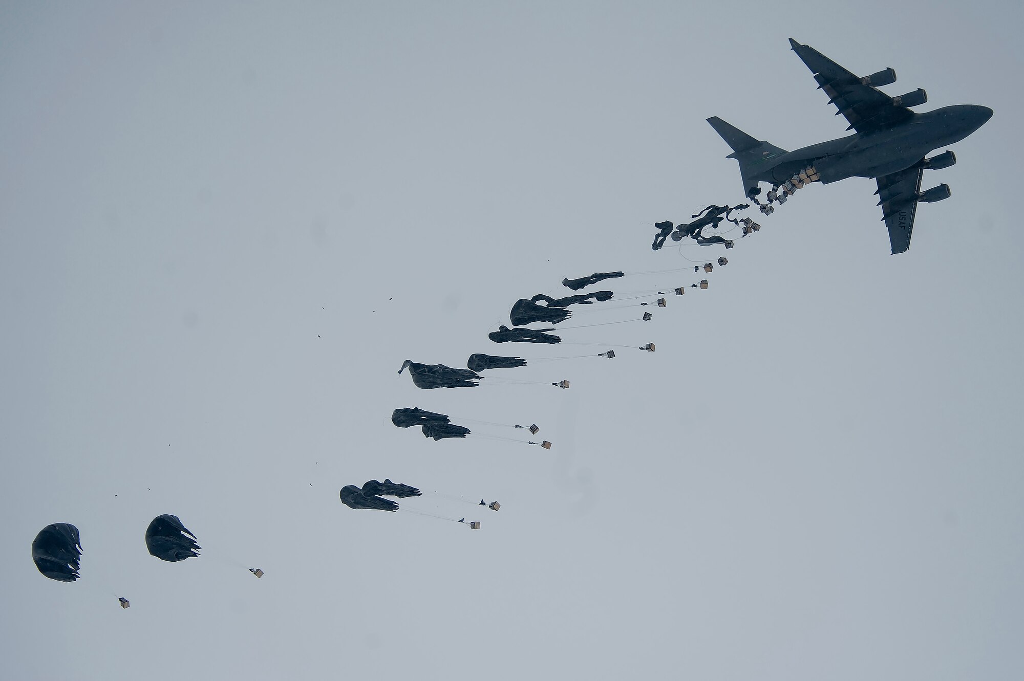 A C-17 Globemaster III air delivers bundles of fuel to Forward Operating Base Waza K'wah in the Paktika province of Afghanistan. The fuel was part of an air delivery to help sustain members of Task Force Currahee, 4th Brigade, 101st Airborne Division, whose only means of re-supply is through air delivery. (U.S. Air Force Photo/ Master Sgt. Adrian Cadiz)