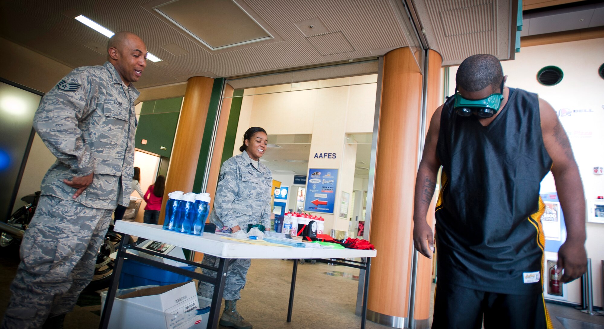 YOKOTA AIR BASE, Japan -- Staff Sgt. Shaun Stallworth, 374th Maintenance Squadron crew chief, attempts to walk a straight line while wearing "beer goggles" here April 15, 2011. Representatives from the 374th Mental Health Clinic were at the Yokota Community Center handing out alcohol abuse information in support of Alcohol Awareness month. (U.S. Air Force photo illustration/Staff Sgt. Chad C. Strohmeyer)