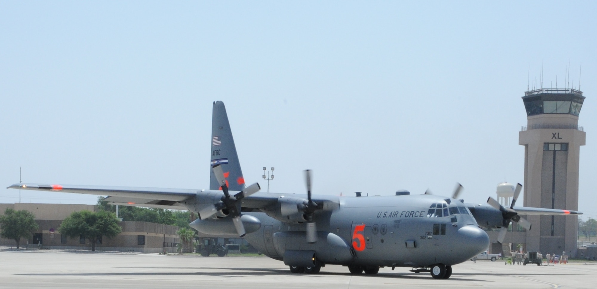 LAUGHLIN AIR FORCE BASE, Texas -- A 302nd Airlift Wing C-130 aircraft, equipped with the U.S. Forest Service Modular Airborne Fire Fighting System, taxis here in preparation to conduct an aerial fire fighting mission over Coahuila, Mexico. Two C-130s, deployed by U.S. Northern Command at the request of the Mexican government, dropped more than 12,000 gallons of fire suppressant today on the wildfires that have burned more than 245,000 acres in Coahuila. (U.S. Air Force photo by Airman 1st Class Blake Mize)