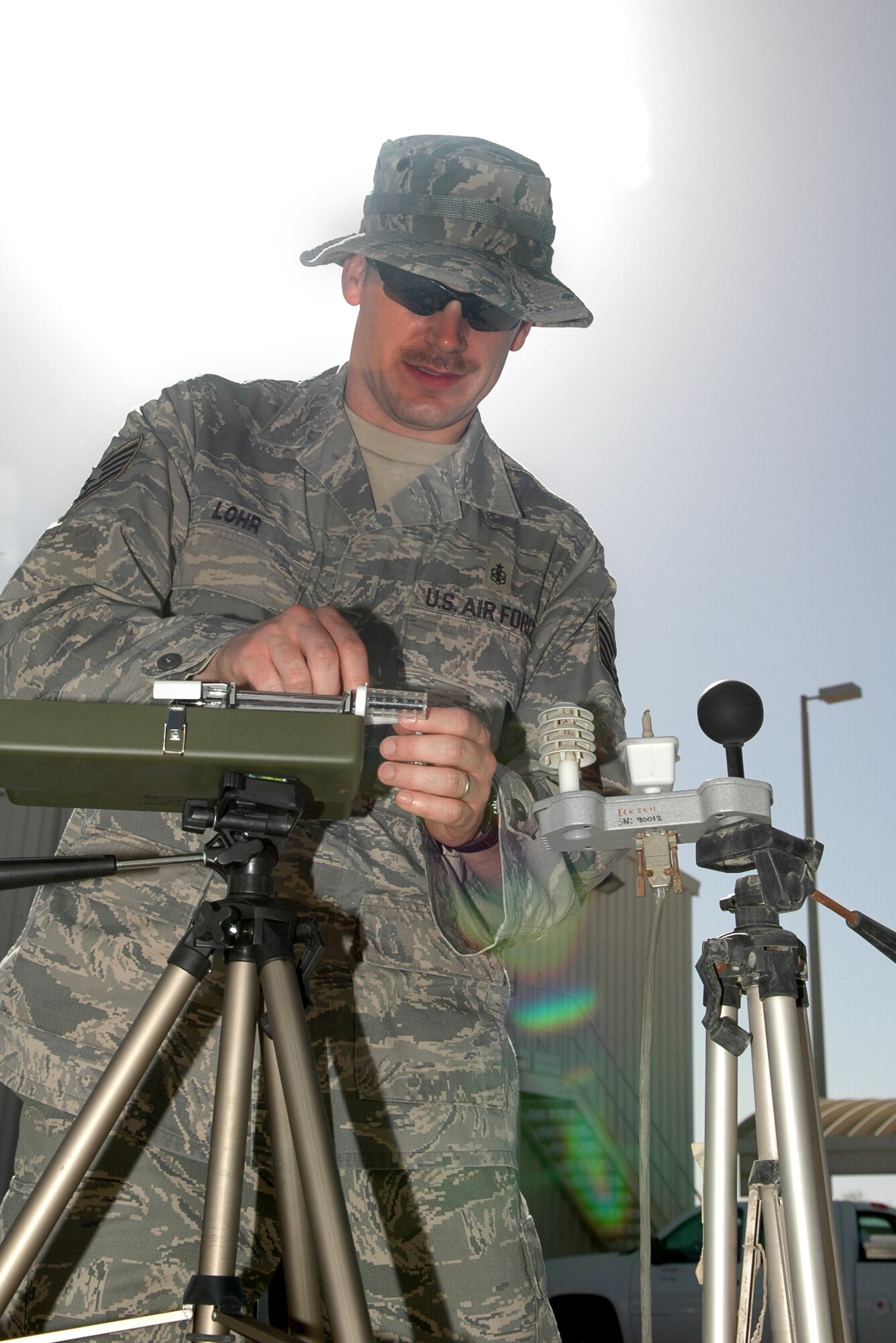 Tech. Sgt. Brian Lohr prepares to take a Wet Bulb Globe Temperature test in Southwest Asia. The WBGT test is a composite temperature used to estimate the effect of temperature, humidity, wind speed and solar radiation on people. The military uses the results of this test to help reduce heat stress injuries. Sergeant Lohr is a Bioenvironmental Engineering Craftsman deployed from Minot AFB, N.D. (U.S. Air Force photo by Master Sgt. Julie Briden-Garcia)