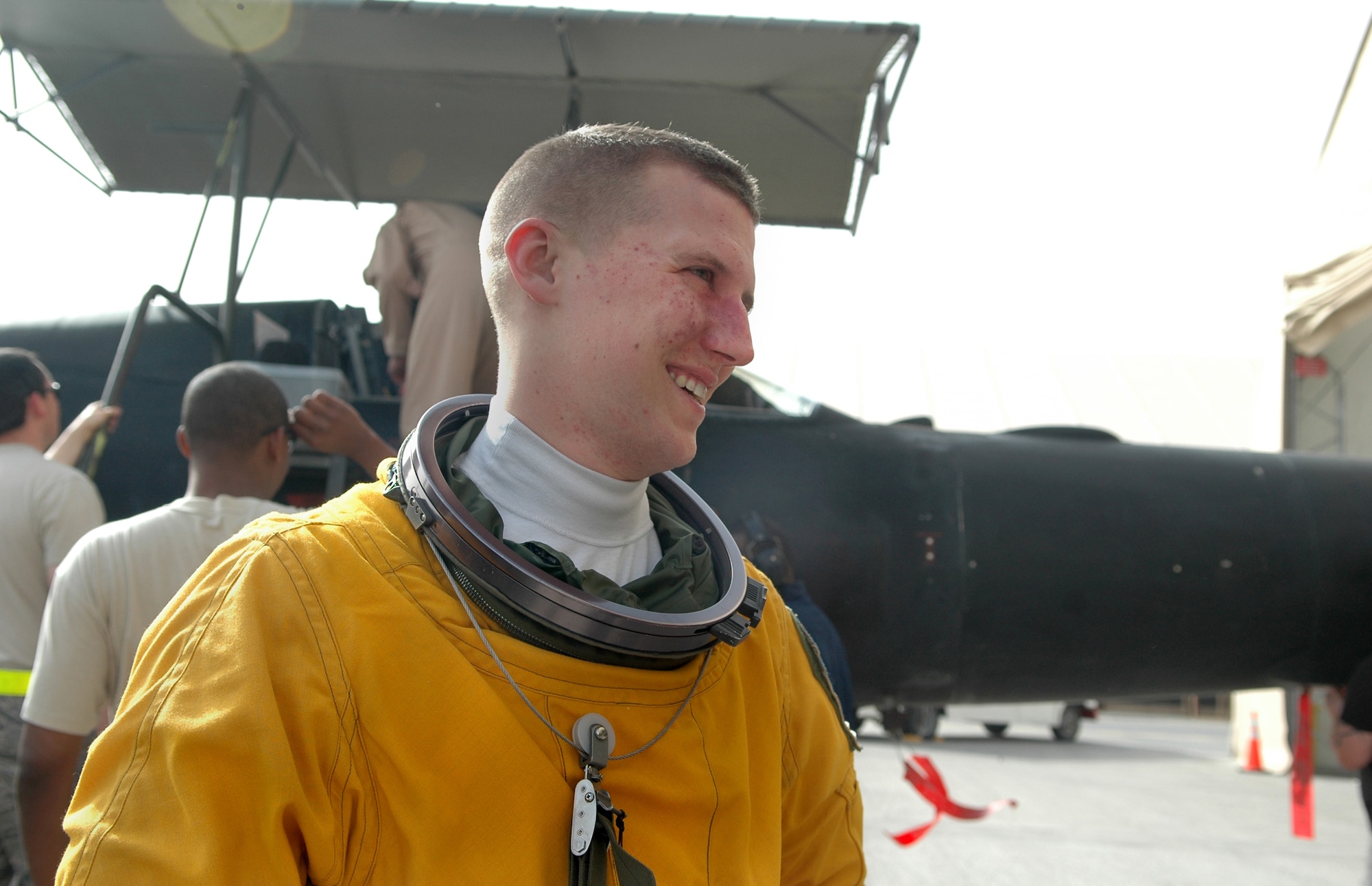 A U.S. Air Force major and U-2S pilot from the 99th Expeditionary Reconnaissance Squadron speaks with the ground crew after completing his 100th combat sortie in support of overseas contingency Operations Iraqi Freedom, Enduring Freedom and Combined Joint Task Force-Horn of Africa in the U.S. Central Command’s Area of Responsibility April 7, 2011. He completed this flying milestone during six deployments in only 2.5 years. (U.S. Air Force photo Master Sgt. Julie Briden-Garcia)