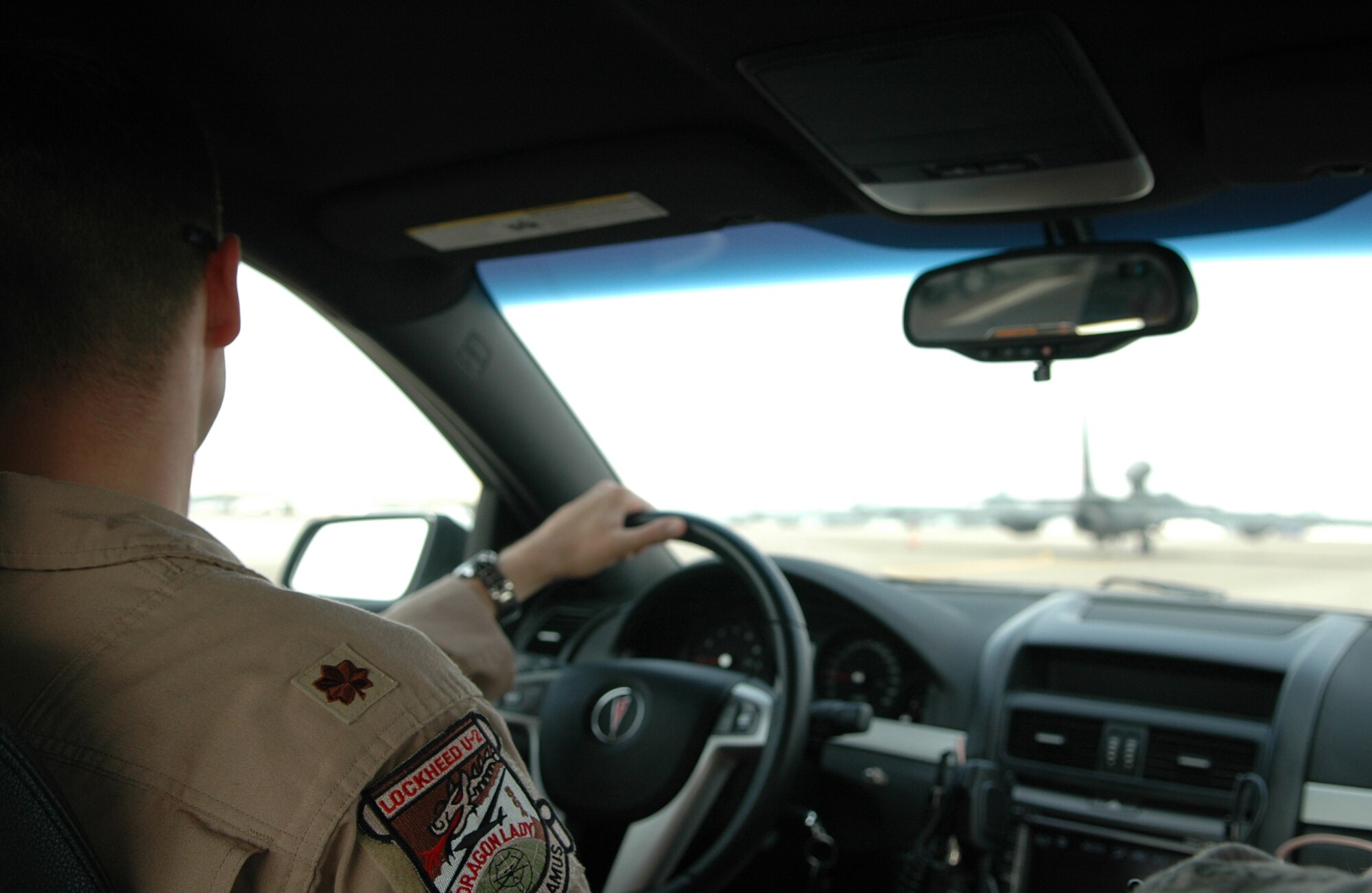 U.S. Air Force major from the 99th Expeditionary Reconnaissance Squadron drives the chase car behind the U-2S pilot after completing 100 combat sorties, helping him land safely through radio transmissions for altitude and runway position April 7, 2011, in Southwest Asia. The U-2S Dragon Lady flies in support of overseas contingency Operations Iraqi Freedom, Enduring Freedom and Combined Joint Task Force-Horn of Africa in the U.S. Central Command’s Area of Responsibility. (U.S. Air Force photo by Master Sgt. Julie Briden-Garcia)
