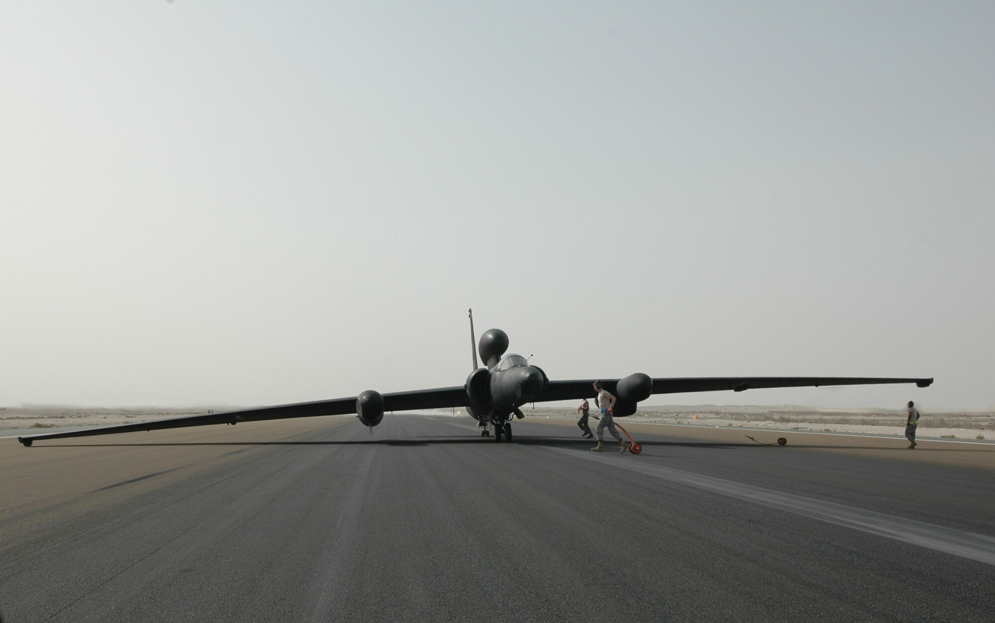 The 380th Expeditionary Aircraft Maintenance Squadron members get ready to place pogo wheels on the U-2S Dragon Lady moments after landing. These bicycle-type wheels are used to support the aircraft's extended wing span during taxi for all take offs and landings. It’s the unique design that gives the U-2 its remarkable performance and makes flying very challenging. (U.S. Air Force photo by Master Sgt. Julie Briden-Garcia)