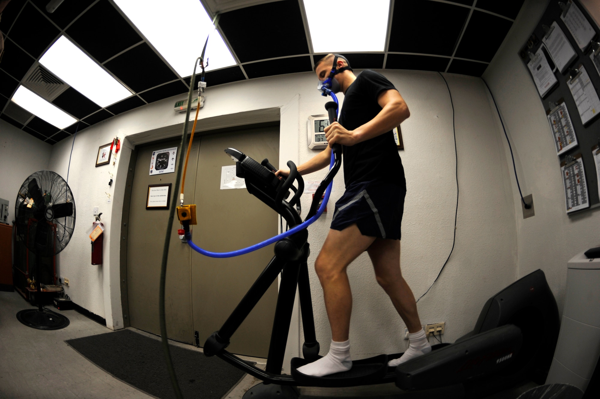 U.S. Air Force major from the 99th Expeditionary Reconnaissance Squadron, runs on an elliptical machine before a mission in a U-2 Dragon Lady in Southwest Asia, Nov. 24, 2010.  U-2 pilots run while breathing 100 percent oxygen before their flight to reduce the amount of nitrogen in their bodies to prevent decompression sickness.  (U.S. Air Force Photo/Staff Sgt. Eric Harris) (RELEASED)