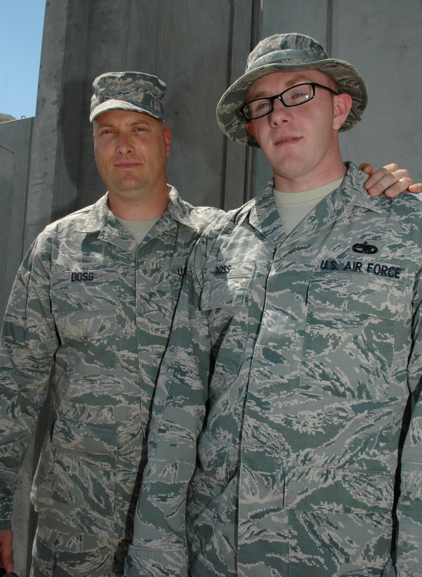 Senior Master Joseph Doss, 380th Expeditionary Civil Engineer Squadron, realized Staff Sgt. Christopher Doss, 380th Expeditionary Aircraft Maintenance Squadron, was his brother during their deployment to the same location in Southwest Asia. The two have been catching up on more than 24 years of lost time. (U.S. Air Force photo by Master Sgt. Julie Briden-Garcia)