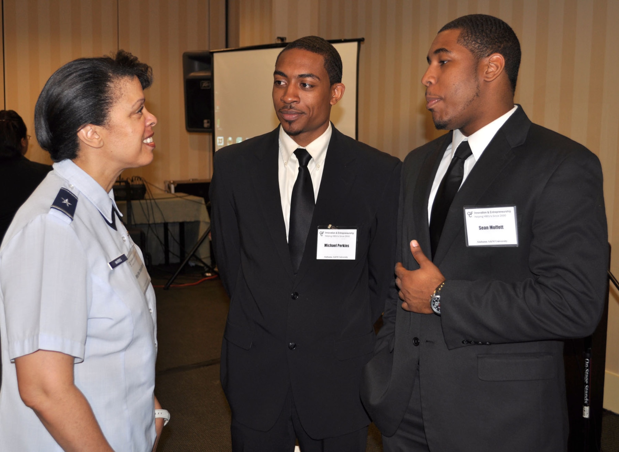 Brig. Gen. Stacey Harris, mobilization assistant to the Commander, U.S. Africa Command, talks with Michael Perkins and Sean Moffett, Alabama A & M University, during the Innovation and Entrepreneurship Challenge in Atlanta April 15, 2011. General Harris served as a judge during the eleventh annual event and used the opportunity to get to know students after they presented a business plan to demonstrate their entrepreneurial skills. 