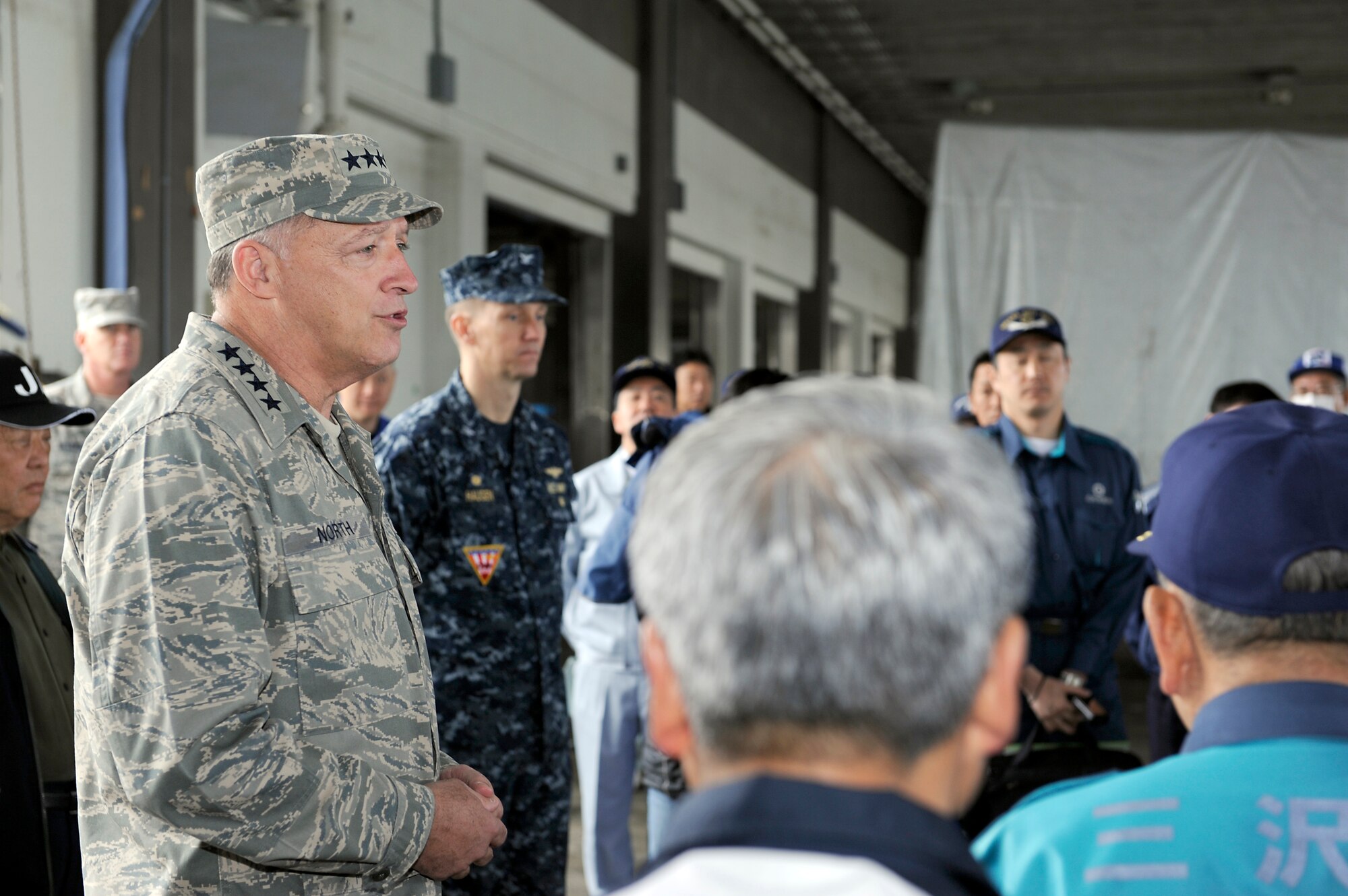 MISAWA AIR BASE, Japan -- Gen. Gary North, Pacific Air Forces commander, addresses the staff of The Misawa Fishery Co-operative Association and other fisherman at the Misawa City Port April 16. General North visited the areas affected by the earthquake to see the effects of the Misawa volunteer efforts. (U.S. Air Force photo by Staff Sgt. Marie Brown\Released)