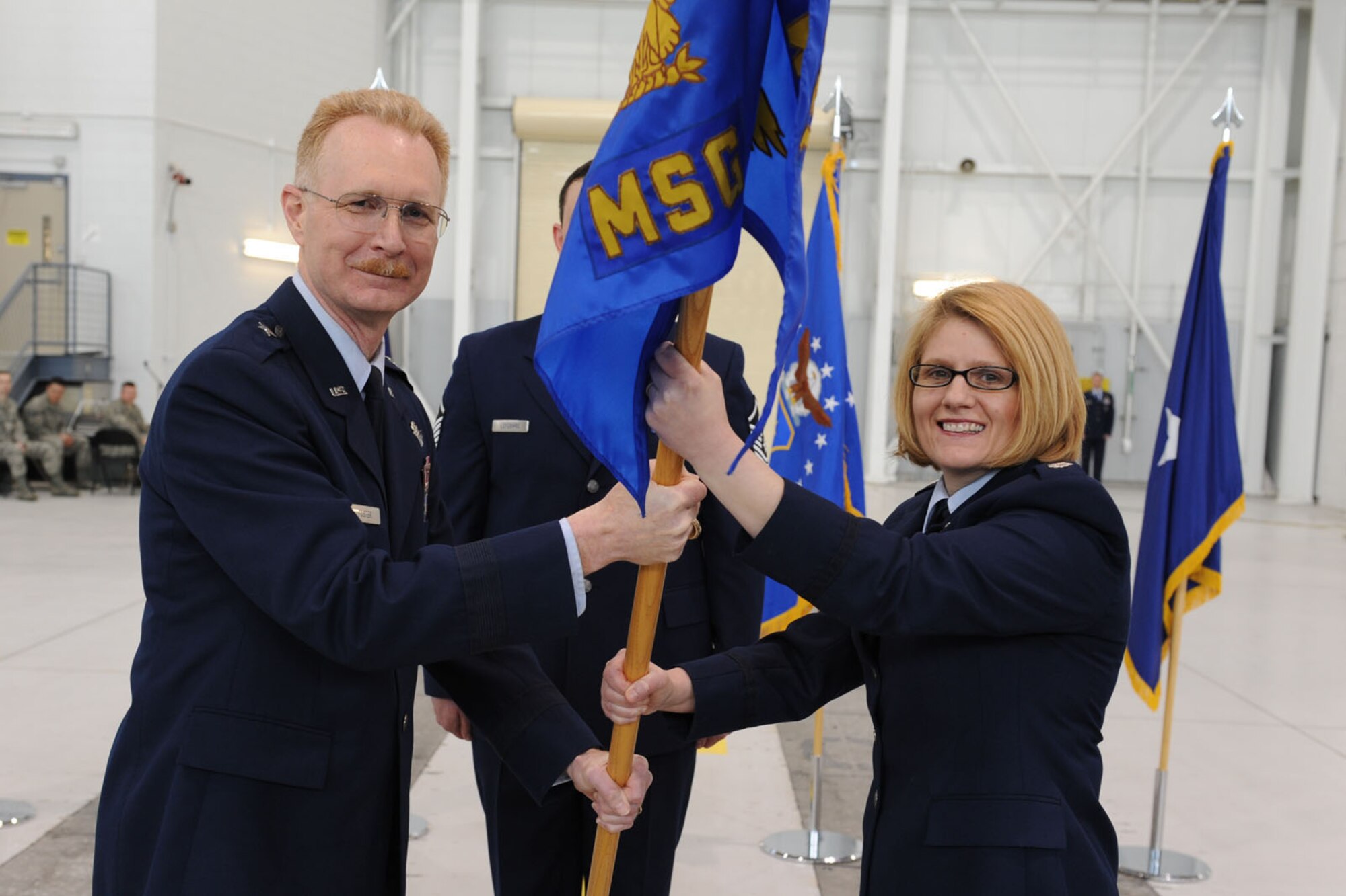 JOINT BASE ELMENDORF-RICHARDSON, Alaska ? Lt. Col. Patty Wilbanks accepts the command of the 176th Mission Support Group, Alaska Air National Guard from Brig. Gen. Charles Foster, commander of the 176th Wing, April 17, 2011. Wilbanks was previously the commander of the 176th Maintenance Group and several of other units within the wing throughout her thirteen years serving in the Alaska Air National Guard. Alaska Air National Guard photo by Master Sgt. Shannon Oleson.