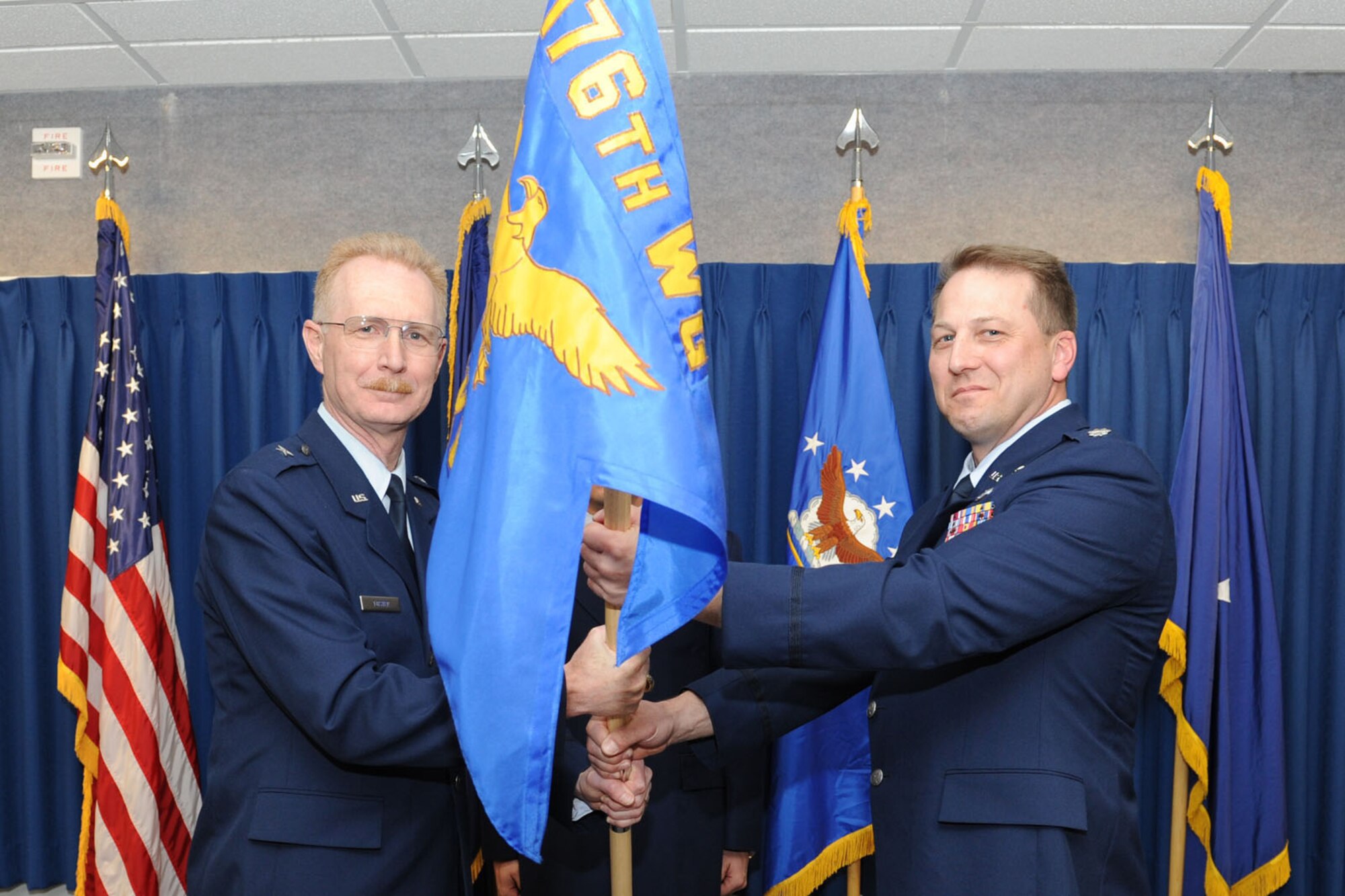 JOINT BASE ELMENDORF-RICHARDSON, Alaska ? Lt. Col. Mark Hedlund from the Joint Forces Headquarters, Alaska, Alaska Air National Guard on Fort Richardson accepts the command of the 176th Maintenance Group, Alaska Air National Guard from Brig. Gen. Charles Foster, commander of the 176th Wing, April 17, 2011. Hedlund recently served as the state director of operations and director of staff and is familiar with the 176th Wing, having previously served as commander of its 144th Airlift Squadron, deputy commander of its 176th Operations Group, and in a variety of other roles. Alaska Air National Guard photo by Master Sgt. Shannon Oleson.