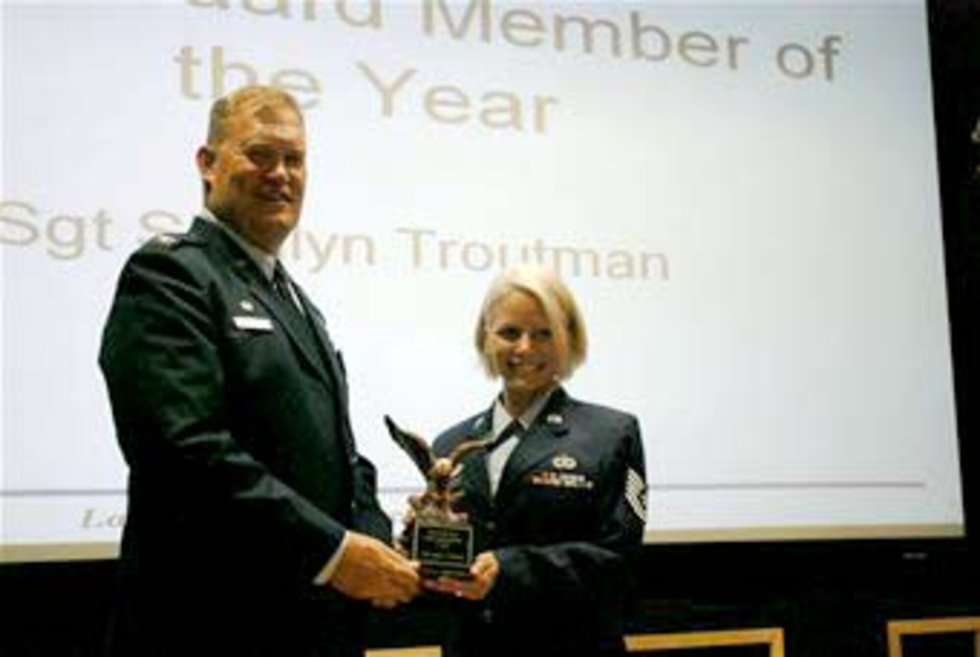 Colonel Kirk Peddicord, 433rd Maintenance Group commander presents Technical Sergeant Shallyn Troutman, 433rd Maintenance Squadron, with the Honor Guard Member of the Year award, Lackland Air Force Base, Texas. (U.S. Air Force photo/Senior Airman Brian McGloin)