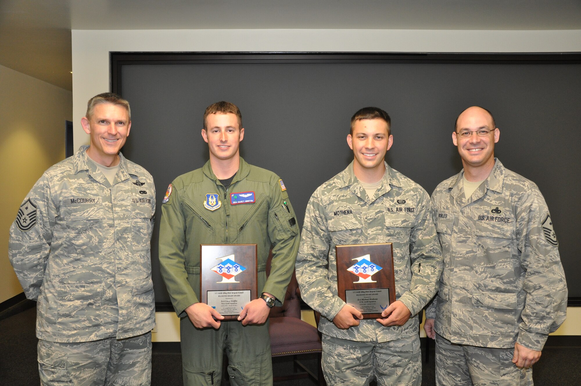 During the April Unit Training Assembly, two members of the 315th Airlift Wing were awarded the Diamond Sharp Award. Senior Airman Casey Griffin, 701st Airlift Squadron and Senior Airman Michael Mothena, 317th Airlift Squadron were both given the award by their First Sergeants to recognize outstanding service from January 2011-March 2011. (U.S. Air Force Photo/Tech. Sgt. Scott Mathews) 