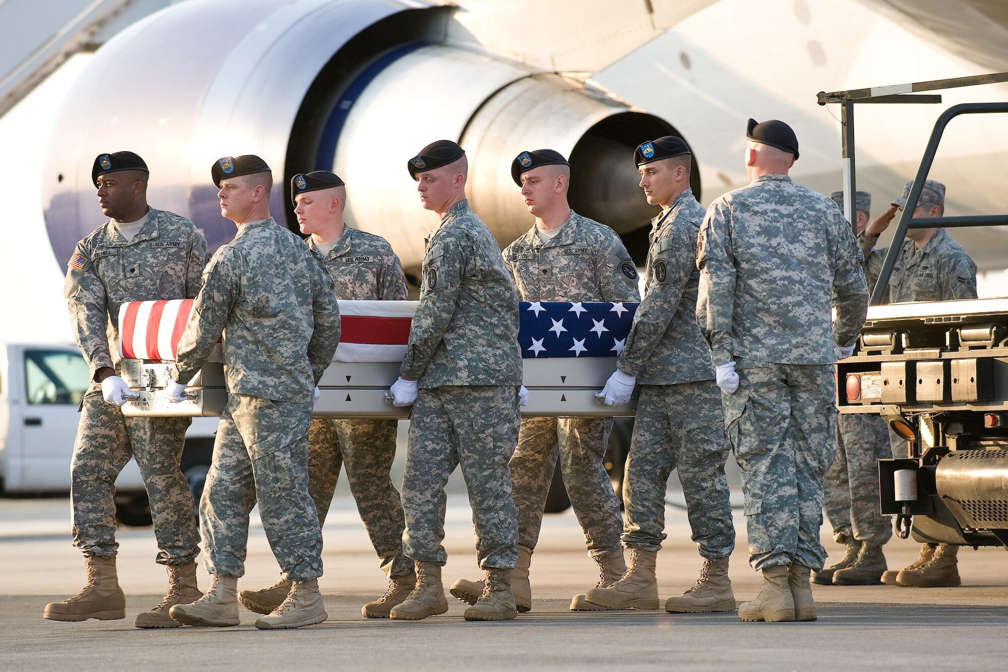 A U.S. Army carry team transfers the remains of Army Sgt. 1st Class Charles L. Adkins, of Sandusky, Ohio, at Dover Air Force Base, Del., April 18, 2011. Adkins was assigned to the 101st Special Troop Battalion, 101st Sustainment Brigade, Fort Campbell, Ky. (U.S. Air Force photo/Roland Balik)