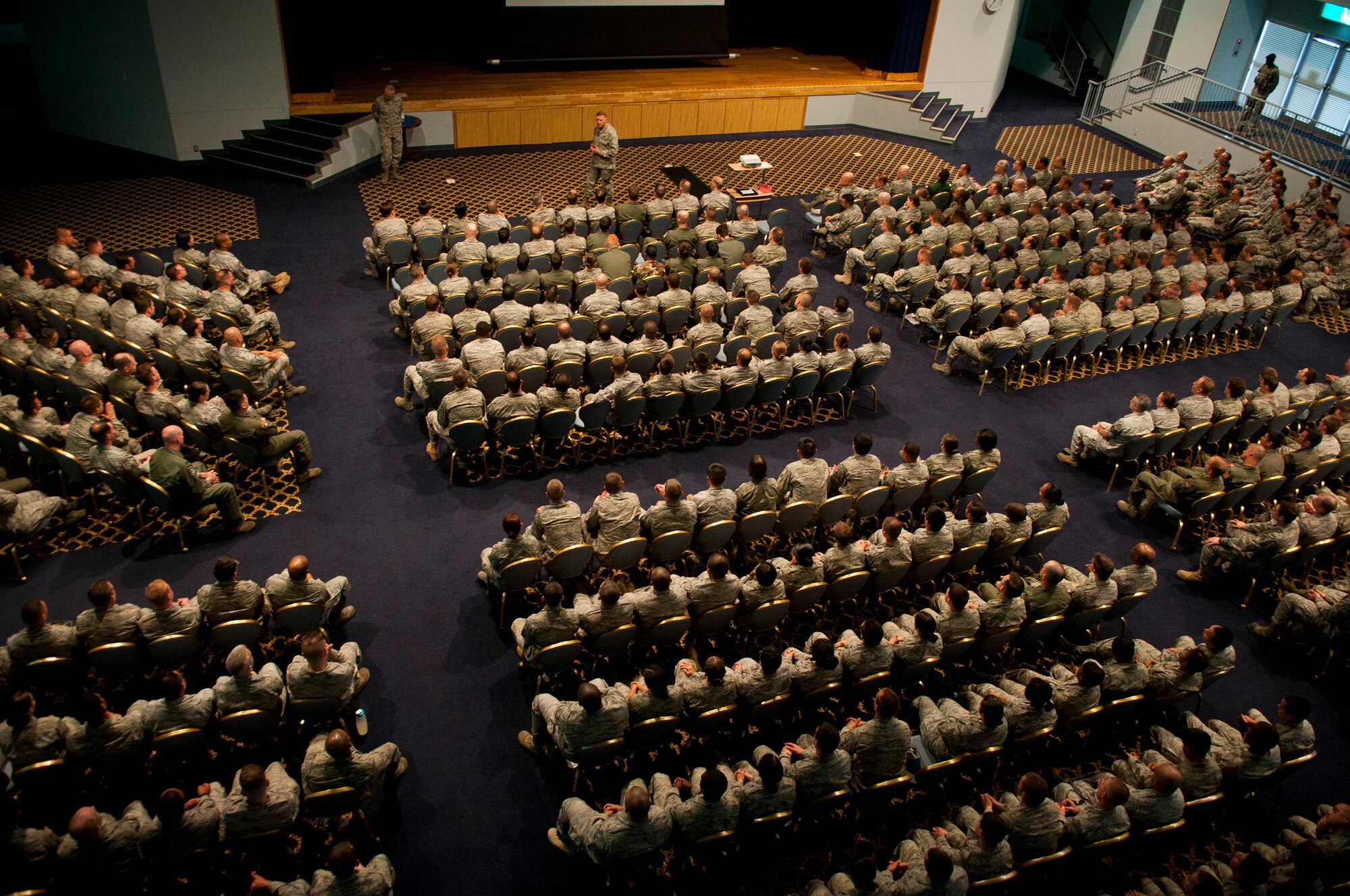 YOKOTA AIR BASE, Japan -- General Gary North, Pacific Air Forces commander, speaks with Yokota Airmen during an "All Call" here April 18. General North visited Yokota AB to thank Airmen for their efforts in Operation Tomodachi. More than 600 Airmen attended the event. (U.S. Air Force photo/Staff Sgt. Chad C. Strohmeyer)