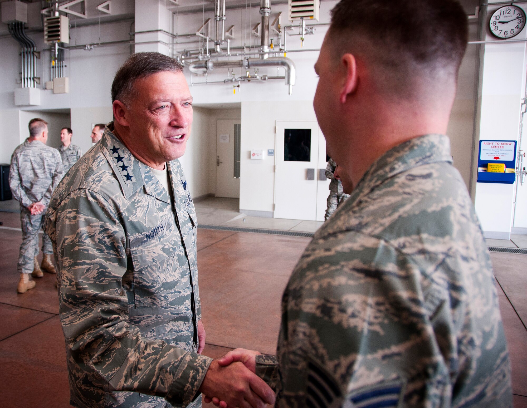YOKOTA AIR BASE, Japan -- General Gary North, Pacific Air Forces commander, shakes hands with Tech. Sgt. Shane Brandhorst, 374th Civil Engineer Squadron firefighter here April 17. General North visited Yokota AB to thank Airmen for their efforts in support of Operation Tomodachi. (U.S. Air Force photo/Staff Sgt. Chad C. Strohmeyer)