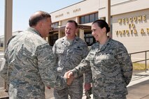 YOKOTA AIR BASE, Japan -- General Gary North, Pacific Air Forces commander, shakes hands with Capt. Laura Apeldoorn, a member of the 730th Air Mobility Squadron, at the AMC passenger terminal April 17. General North visited Yokota Air Base to thank Airmen for their efforts in support of Operation Tomodachi. (U.S. Air Force photo/Osakabe Yasuo)