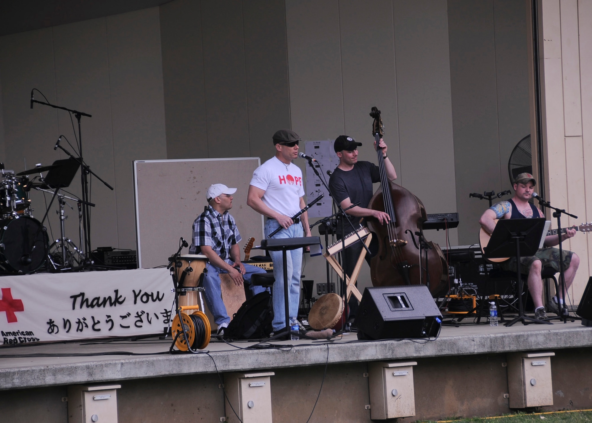 YOKOTA AIR BASE, Japan -- Irish Car Bomb, a local Irish rock band, performs on stage of Yokota's Sakura Shell during Tomodachi Stock 2011 here April 16. Several musicians were able to come together to make the event an enjoyable way for Team Yokota to rest and relax, while also donating to the American Red Cross. (U.S. Air Force photo/Senior Airman Andrea Salazar)