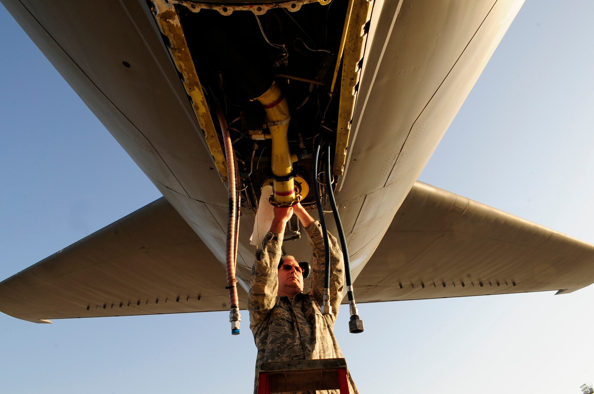 Tech. Sgt. David Sparkman cleans off the boom strut of a KC-135 Stratotanker April 12, 2011, to prepare it for a magnetic particle inspection. Sergeant Sparkman is from the Pennsylvania Air National Guard’s 171st Air Refueling Wing and is deployed with the 313th Air Expeditionary Wing at an air base in Western Europe supporting Operation Unified Protector, a NATO-led mission in Libya, to protect civilians and civilian-populated areas under threat of attack. The 313th AEW provides aerial refueling to U.S. and coalition aircraft using KC-135 Stratotankers and KC-10 Extenders. (U.S. Air Force photo/Senior Airman Ethan Morgan)