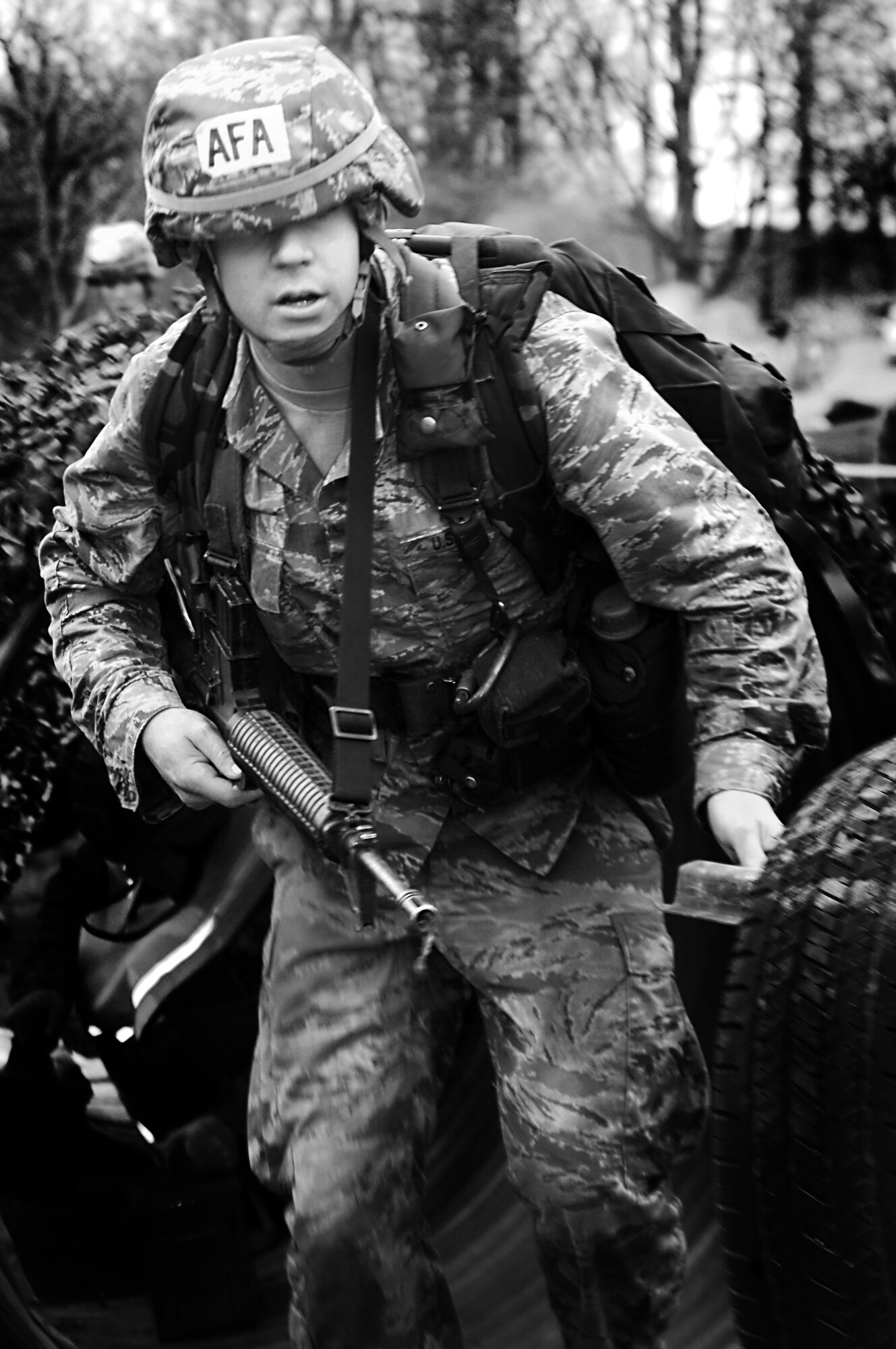 Cadet 2nd Class David Fox pushes through one of the final obstacles during the Sandhurst Competition Saturday, April 16, 2011 at the U.S. Military Academy, N.Y.  The competition requires each team to perform a series of challenging military tasks along a 7-mile route, and compete in a marksmanship competition.  The team only had a rough idea of what to train for as most of the challenges were kept secret until the day of the event.  (U.S. Air Force photo/Staff Sgt. Raymond Hoy)