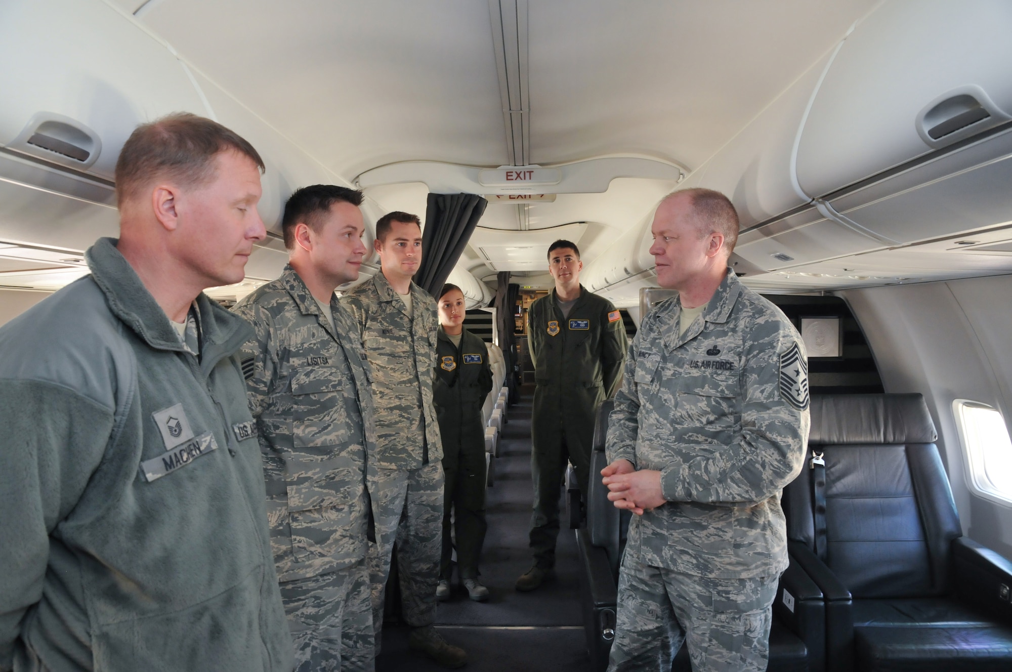 Command Chief Master Sgt. Christopher Muncy, Air National Guard Command Chief Master Sergeant, talks with crewmembers from the 201st Airlift Squadron during a visit to District of Columbia Air National Guard, April 17, 2011. The Chief was invited to talk with the Airmen of the unit as well as visit different workspaces to get a better idea of the 113th Wing mission. (U.S. Air Force photo by Master Sgt. Dennis Young)