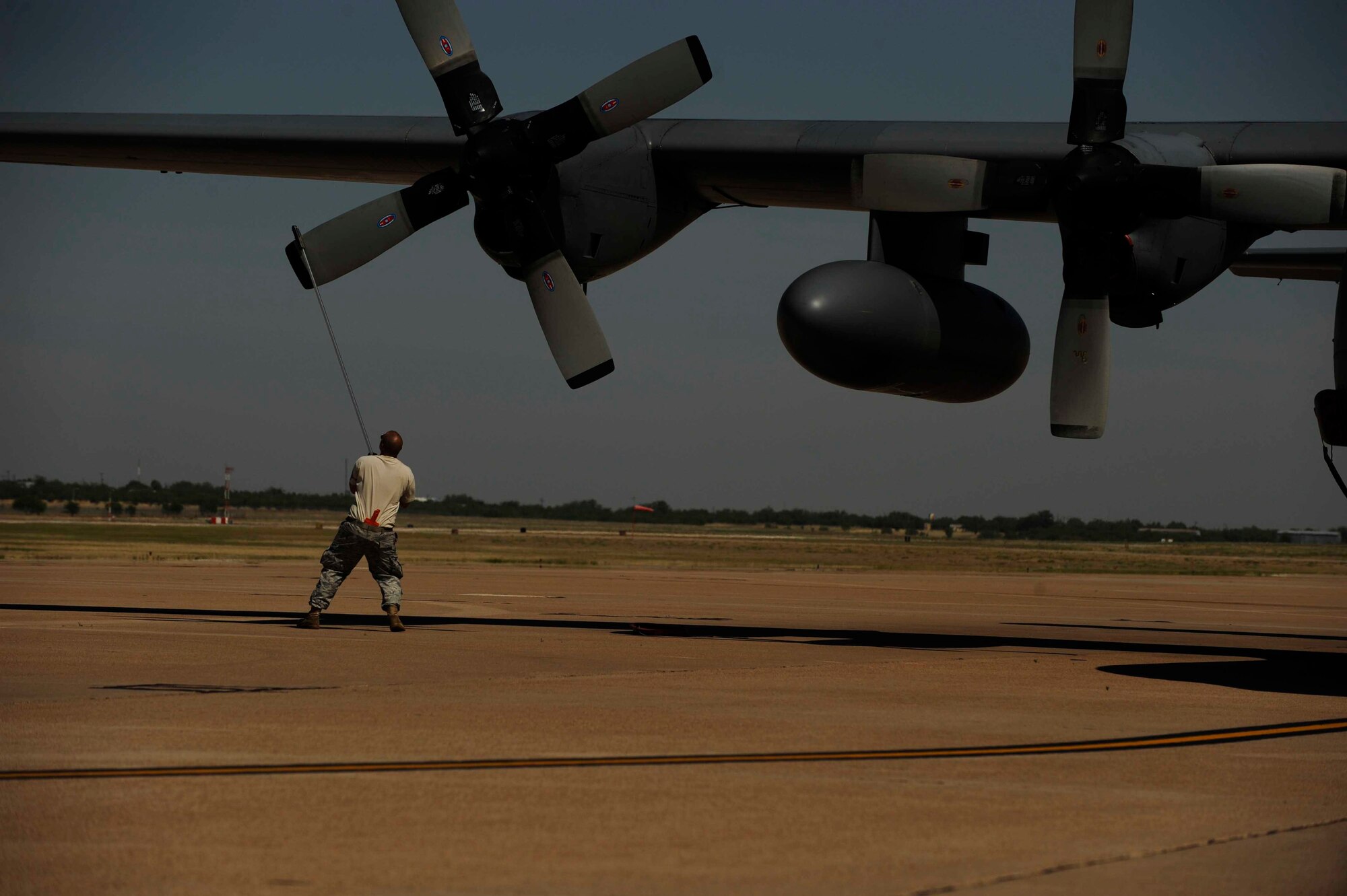 U.S. Air Force Tech. Sgt. Joe Burriss, 145th Aircraft Maintenance Squadron, North Carolina Air National Guard, prepares a C-130H Hercules for firefighting operations at Dyess Air Force Base, Texas, April 18, 2011.  The C-130 is equipped with the Modular Airborne Firefighting System(MAFFS) which is capable of dispensing 3,000 gallons of water or fire retardant in under 5 seconds.  (U.S. Air Force Photo/Staff Sgt. Eric Harris)