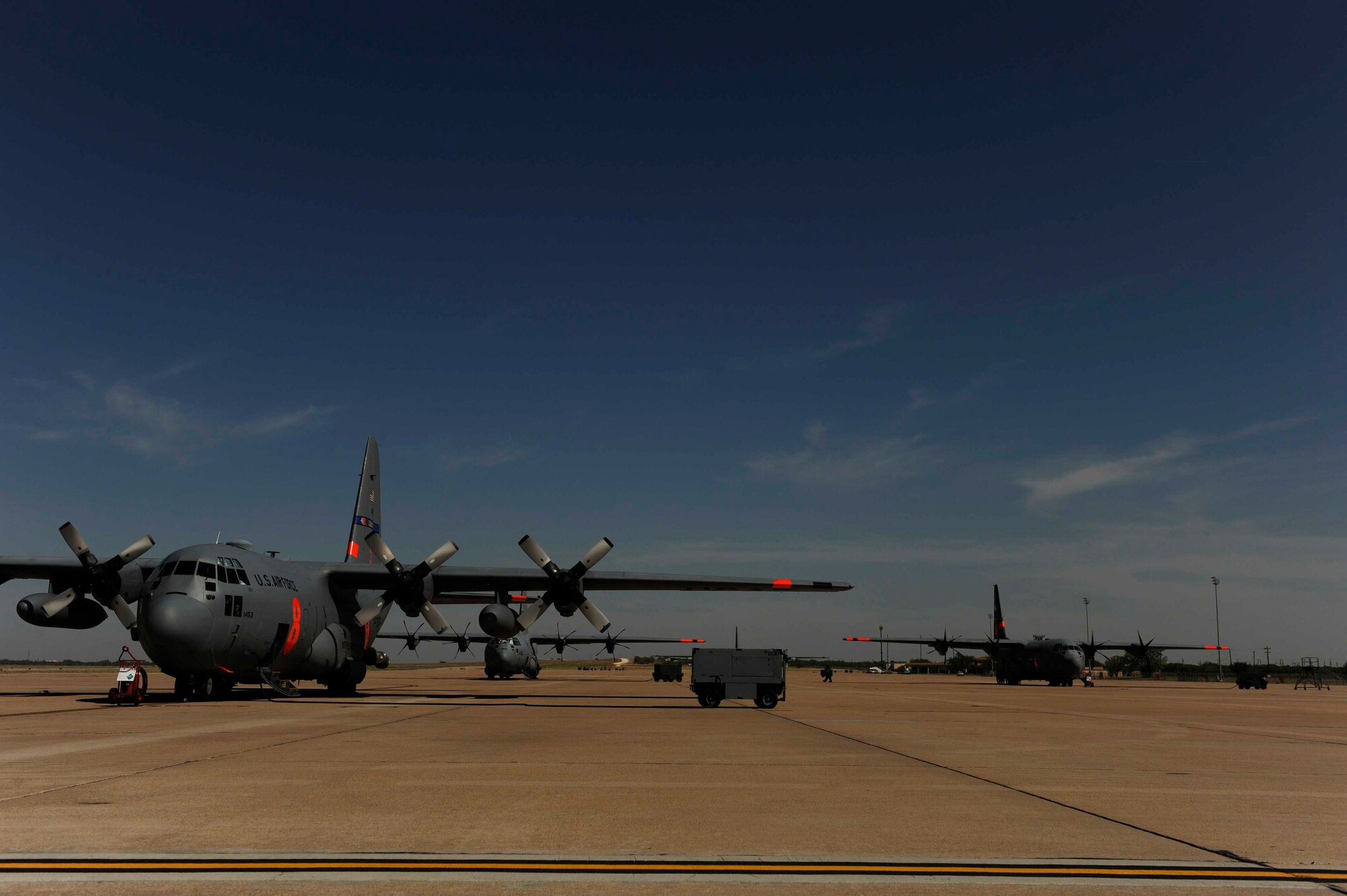 Airmen from California Air National Guard's 146th Airlift Wing, North Carolina Air National Guard's 145th Airlift Wing and Wyoming Air National Guard's 153rd Airlift Wing gather at Dyess Air Force Base, Texas to prepare for wildfire fighting operations, April 18, 2011.  The Airmen maintain and operate the Modular Airborne Firefighting System (MAFFS) housed aboard a C-130 Hercules which is capable of dispensing 3,000 gallons of water or fire retardant in under 5 seconds.  The wildfires have spread across various parts of Texas and have burned more than 1,000 square miles of land.  (U.S. Air Force Photo/Staff Sgt. Eric Harris)
