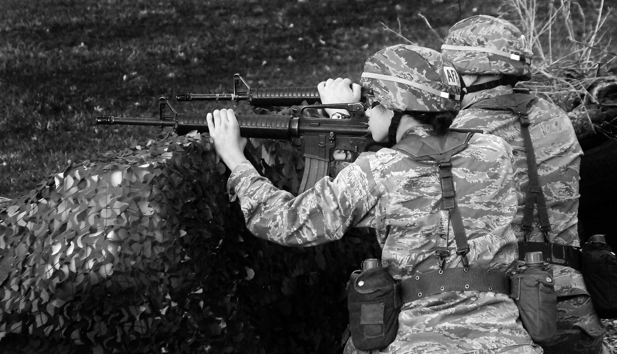 Members of the Air Force Sandhurst team fire at pop-up targets during the combat shooting portion of the Sandhurst Competition Saturday, April 16, 2011 at the U.S. Military Academy, N.Y.  The competition requires each team to perform a series of challenging military tasks along a 7-mile route, and compete in a marksmanship competition.  The team only had a rough idea of what to train for as most of the challenges were kept secret until the day of the event.  (U.S. Air Force photo/Staff Sgt. Raymond Hoy)