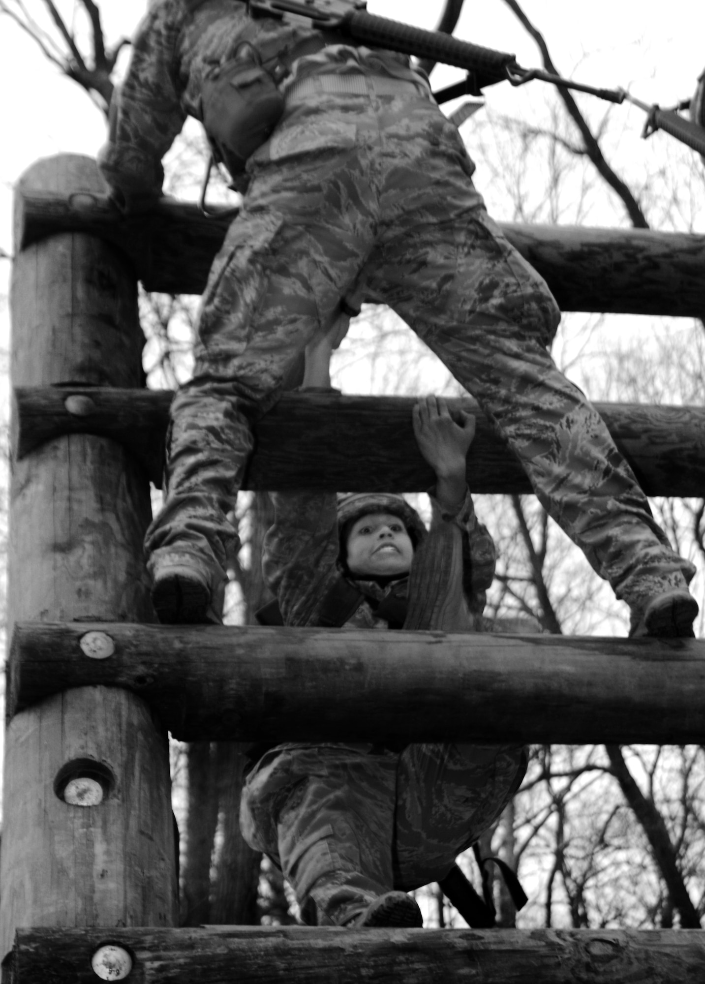 Cadet 3rd Class Dominique Amor climbs one of 11 obstacles the Air Force Sandhurst team had to complete during that portion of the Sandhurst Competition Saturday, April 16, 2011 at the U.S. Military Academy, N.Y.  The competition requires each team to perform a series of challenging military tasks along a 7-mile route, and compete in a marksmanship competition.  The team only had a rough idea of what to train for as most of the challenges were kept secret until the day of the event.  (U.S. Air Force photo/Staff Sgt. Raymond Hoy)