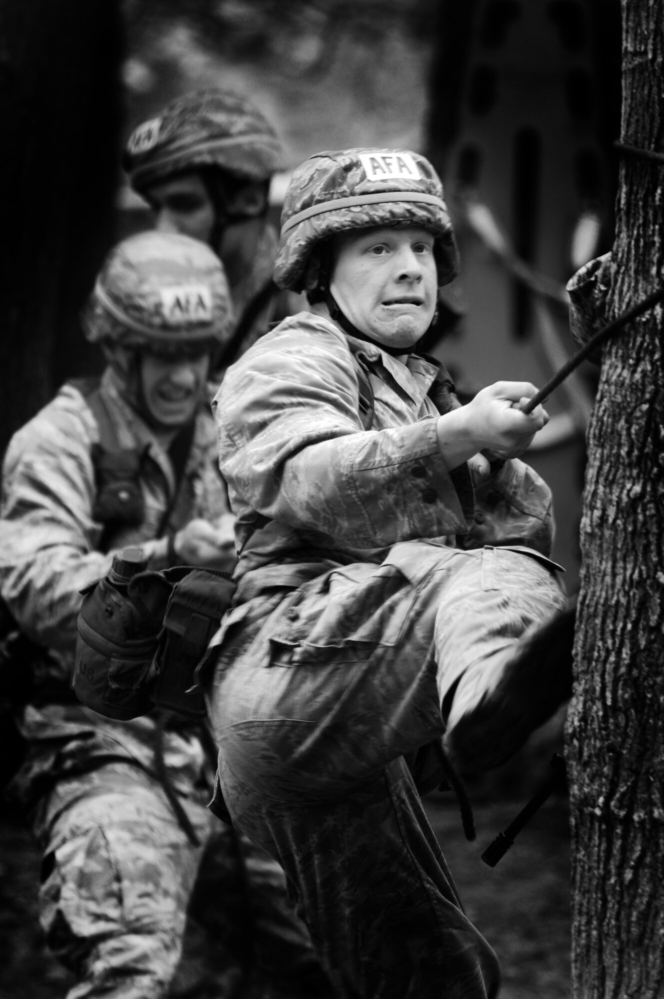 Cadet 2nd Class William Friedl and his team secure a rope to a tree during the rope bridge portion of the Sandhurst Competition Saturday, April 16, 2011 at the U.S. Military Academy, N.Y.  The competition requires each team to perform a series of challenging military tasks along a 7-mile route, and compete in a marksmanship competition.  The team only had a rough idea of what to train for as most of the challenges were kept secret until the day of the event.  (U.S. Air Force photo/Staff Sgt. Raymond Hoy)