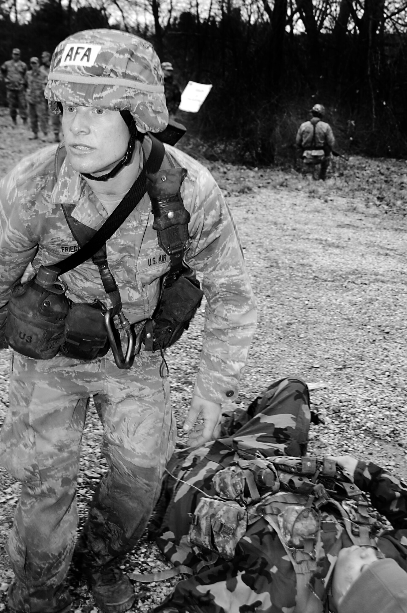 Cadet 3rd Class William Friedl renders aid to a simulated casualty during the first aid portion of the Sandhurst Competition Saturday, April 16, 2011 at the U.S. Military Academy, N.Y.  The competition requires each team to perform a series of challenging military tasks along a 7-mile route, and compete in a marksmanship competition.  The team only had a rough idea of what to train for as most of the challenges were kept secret until the day of the event.  (U.S. Air Force photo/Staff Sgt. Raymond Hoy)