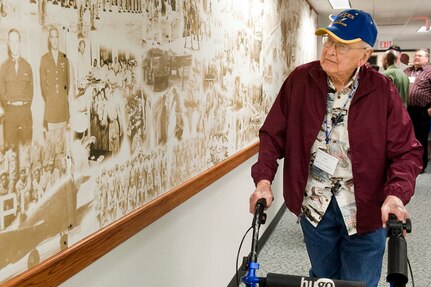 Art Mattson, a B-24 gunner assigned to the 455th Bombardment Group during World War II, tours the 99th Flying Training Squadron April 15 at Randolph Air Force Base, Texas, as part of the Air Force Escape and Evasion Society 2011 San Antonio Reunion. Mr. Matson, who evaded the Nazis for 4.5 months with the help of the Italian Underground, fondly remembers being escorted by the Tuskegee Airmen during missions over Italy. (U.S. Air Force photo/Steve Thurow)