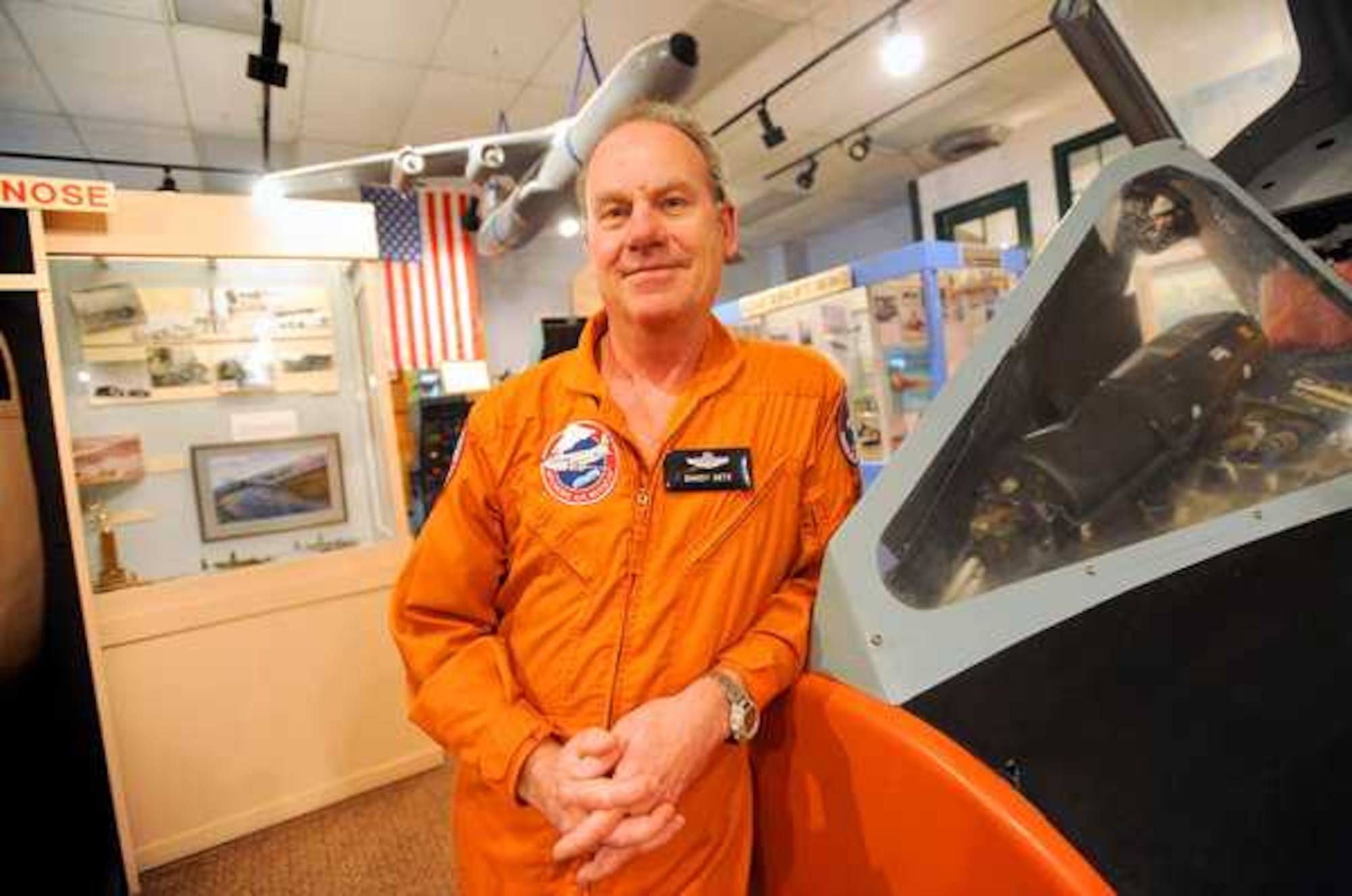 Volunteer Randy Getz stands next to the F-106 Delta Dart Simulator in the McChord Air Museum at Joint Base Lewis-McChord, Wash. (U.S. Air Force photo/Ingrid Barrentine)
