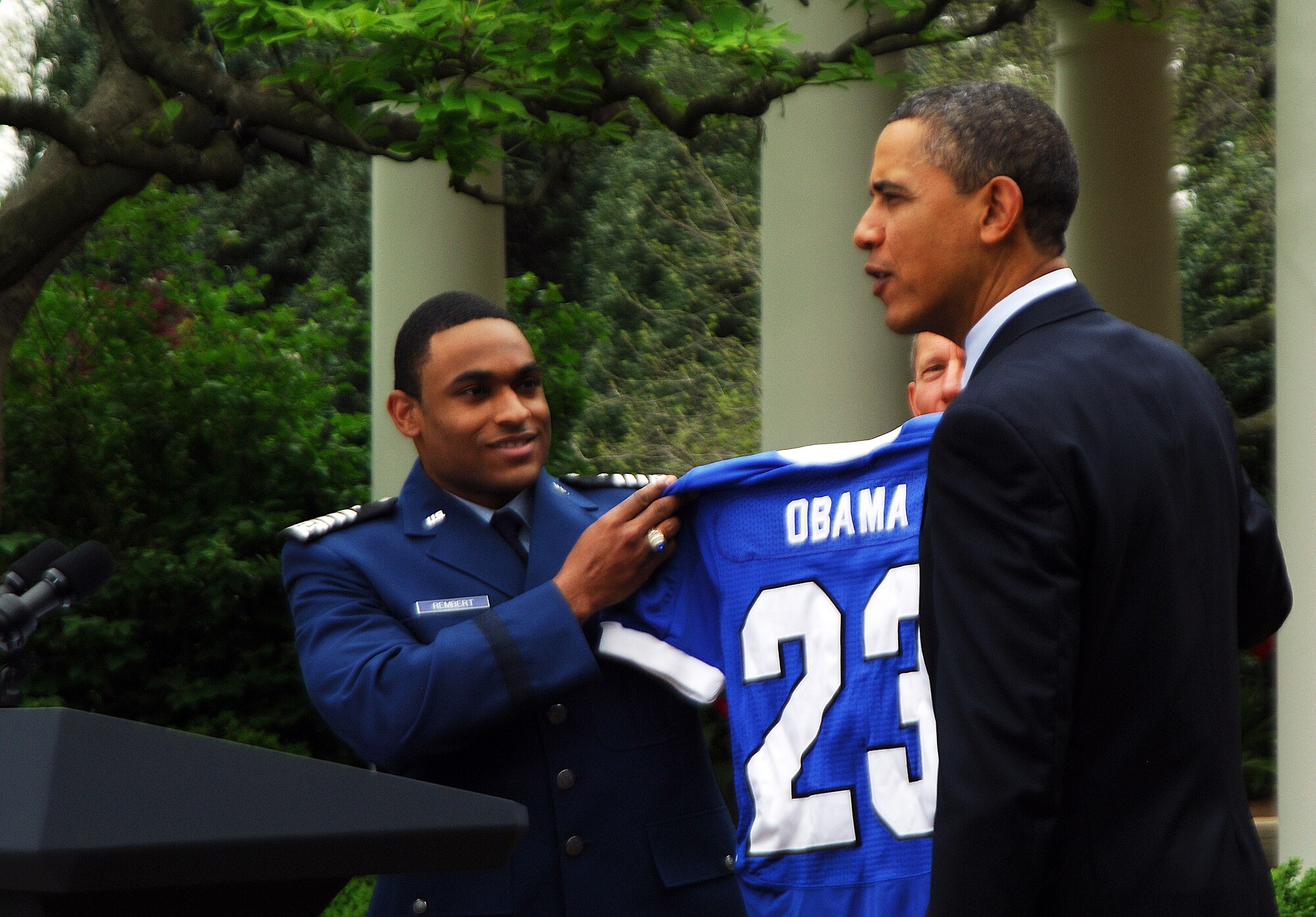 President Barack Obama receives a Falcons jersey with the same number he wore on his high school basketball jersey from defensive back Reggie Rembert after presenting the 2010 Air Force Academy football team with the Commander-in-Chief's Trophy at the White House Monday, April 18, 2011.  This is the 17th time the Falcons have won the trophy and the first since 2002.  (U.S. Air Force photo/Staff Sgt. Raymond Hoy)