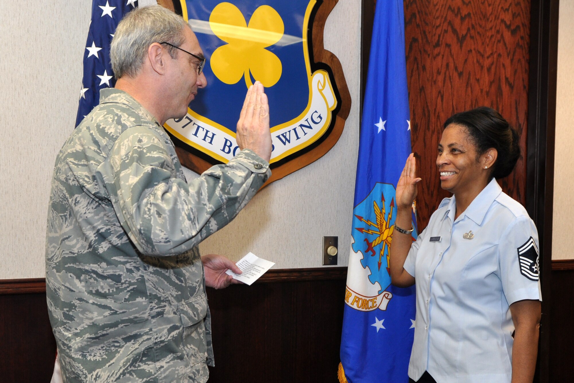 Senior Master Sgt. Laraine Warren-Dawn, services superintendent, 307th Force Support Squadron, takes the re-enlistment oath from Brig. Gen. John J. Mooney III, the commander of the 307th Bomb Wing at Barksdale Air Force Base, La., March 16, 2011. Sergeant Warren-Dawn has a long and distinguished career with the Reserve Wing at Barksdale AFB, which began in 1981. As an Air Reserve Technician for the 307th BW, her day-to-do activities revolve around all of the activities of Services. (U.S. Air Force photo/Tech. Sgt. Jeff Walston)