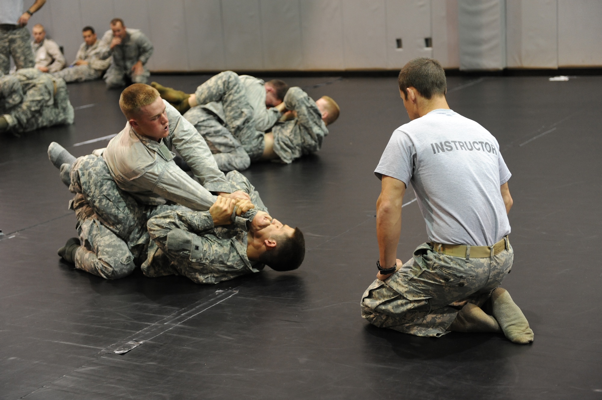 Tactial Air Control Party students test their new combatives skills on each other at Hurlburt Field, Fla., March 31, 2011. The TACPs adopted the new curriculum as part of the Air Force Combatives Program, initated January 2008. (U.S. Air Force photo by Airman 1st Class Caitlin O'Neil-McKeown/RELEASED) 