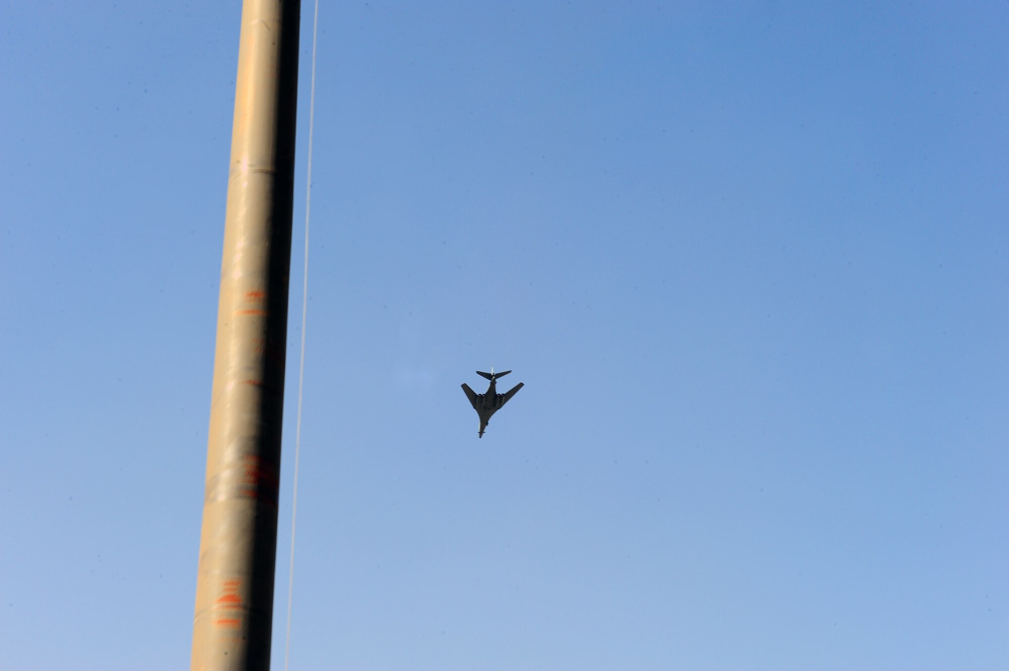 DYESS AIR FORCE BASE, Texas— A Dyess B-1 Bomber performs a fly-over during a retreat ceremony April 15 at the traffic circle here. A retreat ceremony signifies the end of a duty day and is also a way to pay tribute to the American flag. (U.S. Air Force photo/ Airman 1st Class Courtney Moses)