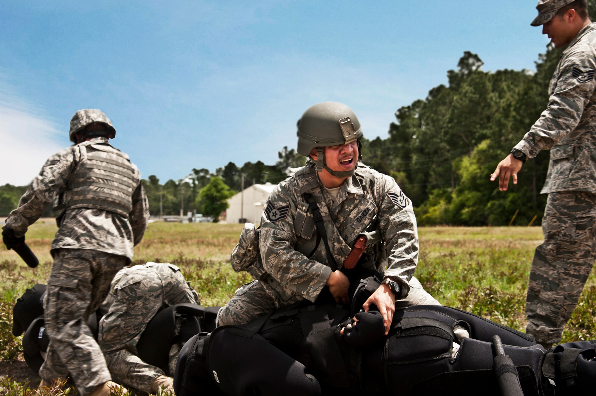 Staff Sgt. Eric Garza, 10th Security Forces Squadron, subdues a suspect during a Fly Away Security Team training session April 14 at Eglin Air Force Base.  The course, taught by 96th Ground Combat Training Squadron instructors, brought together security forces Airmen from all over the U.S. to learn how to protect aircraft and handle potential hostile situations.  (US. Air Force photo/Samuel King Jr.)