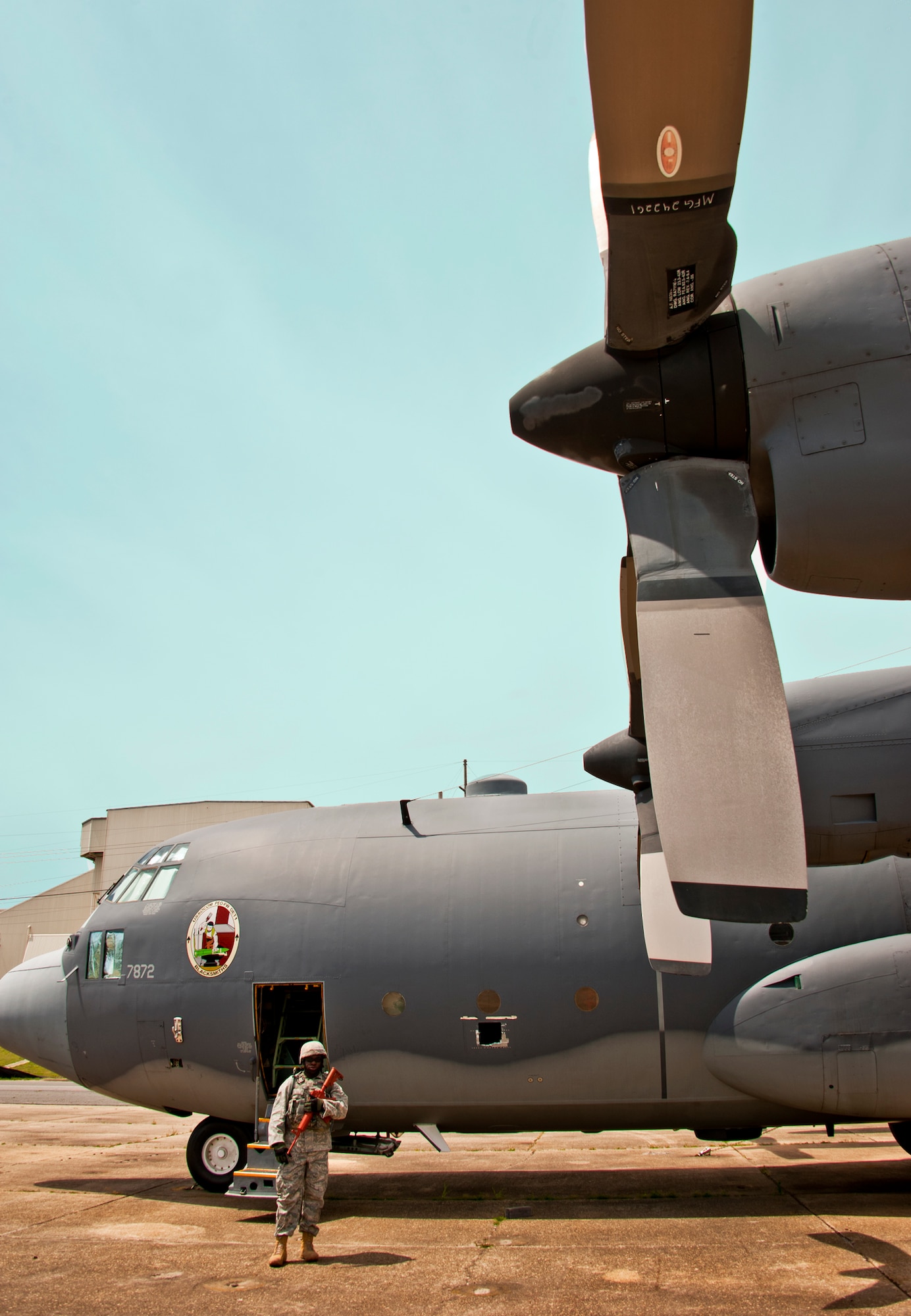 Senior Airman Bobby Brown, 375th Security Forces Squadron, waits by a C-130 for the next scenario to begin during the Fly Away Security Team training session April 14 at Eglin Air Force Base.  The course, taught by 96th Ground Combat Training Squadron instructors, brought together security forces Airmen from all over the U.S. to learn how to protect aircraft and handle potential hostile situations.  (US. Air Force photo/Samuel King Jr.)