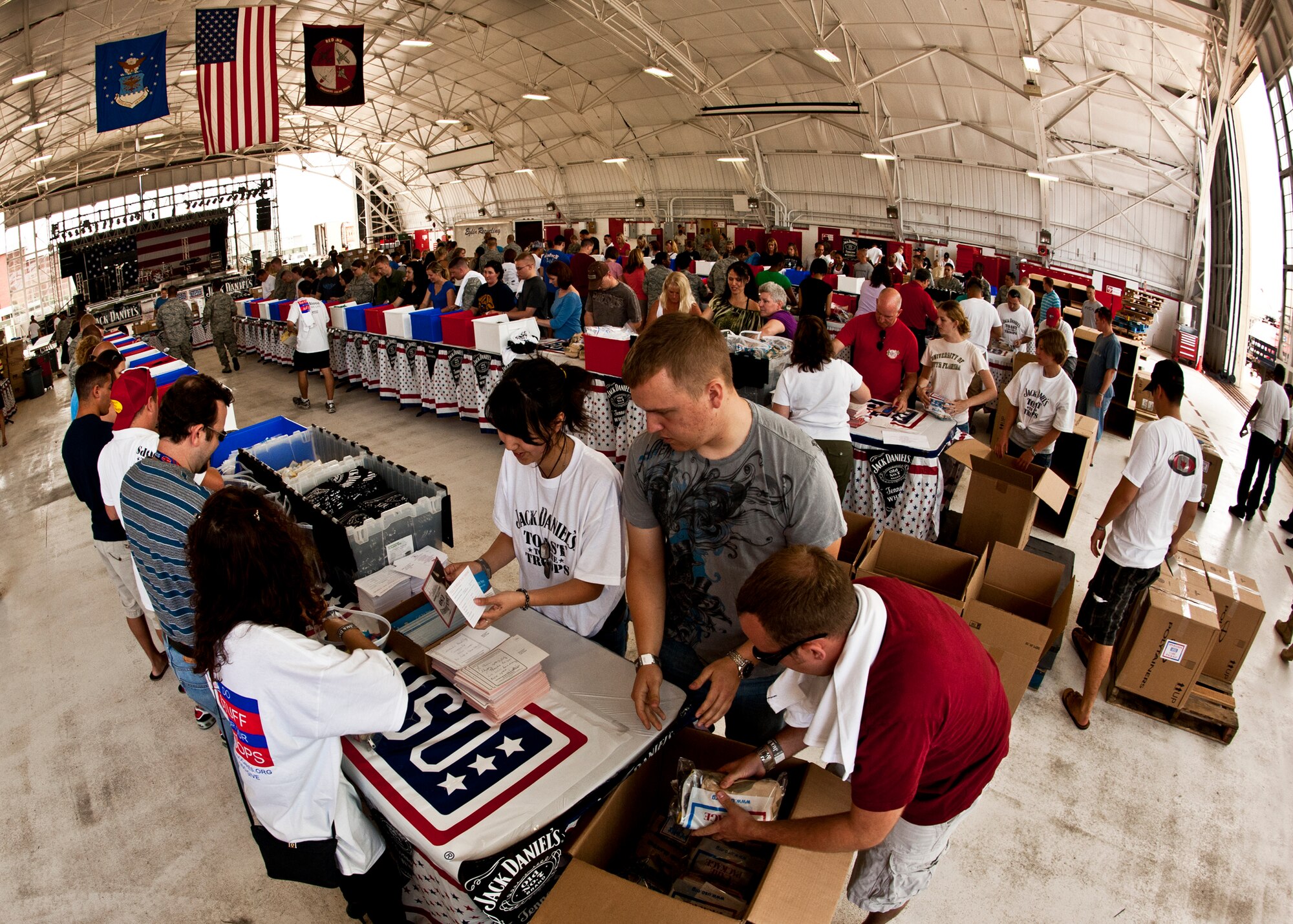 More than 180 volunteers participated in the Jack Daniel's/USO Toast to the Troops Program by assembling thousands of Operation USO Care Packages for the troops serving overseas. More than 150,000 care packages have been sent to our troops through this program since 2005. (USAF photo/Samuel King Jr.)     

