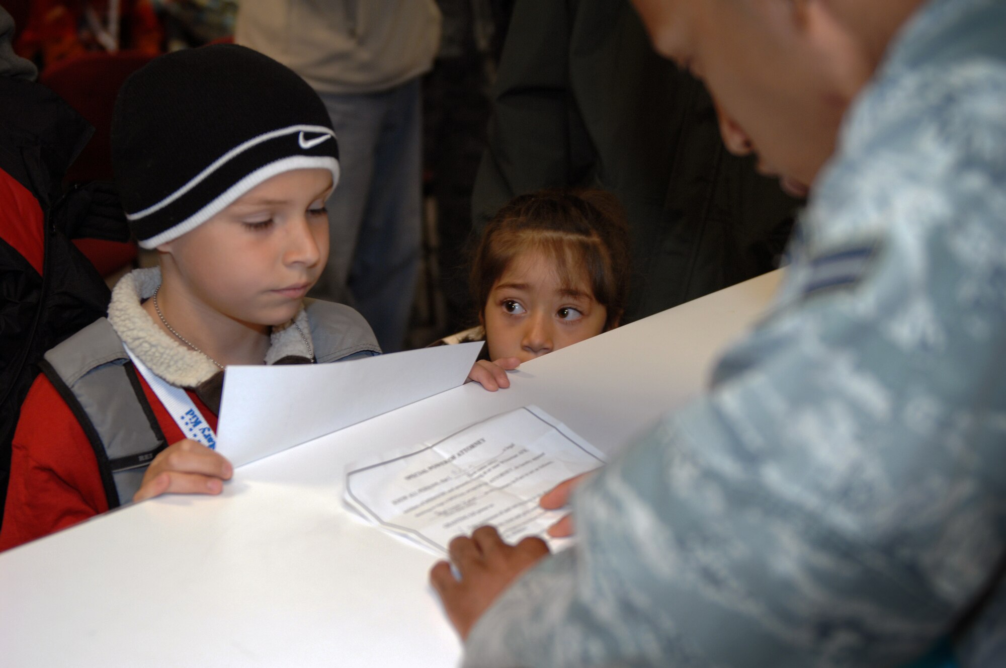 WHITEMAN AIR FORCE BASE, Mo. -- A child receives orders while out-processing during Operation Spirit April 16, 2011. Operation Spirit is hosted once a year to show military children a piece of what their parents might experience through a deployment.  (U.S. Air Force photo by Airman 1st Class Cody H. Ramirez)
