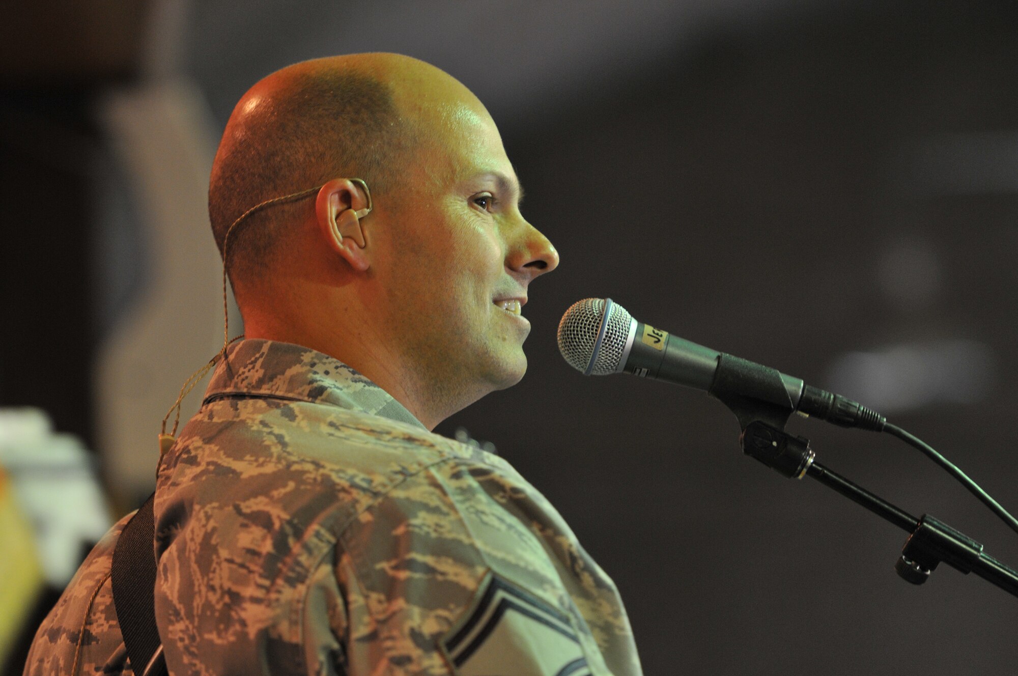 Senior Master Sgt. Jermoe Oddo, lead vocals and bass of "Wild Blue Country," the U.S. Air Forces Central Band, thanks the Airmen of the 438th Air Expeditionary Wing for coming out and listen to them play a set. (U.S. Air Force photo by Tech. Sgt. Brian E. Christiansen)