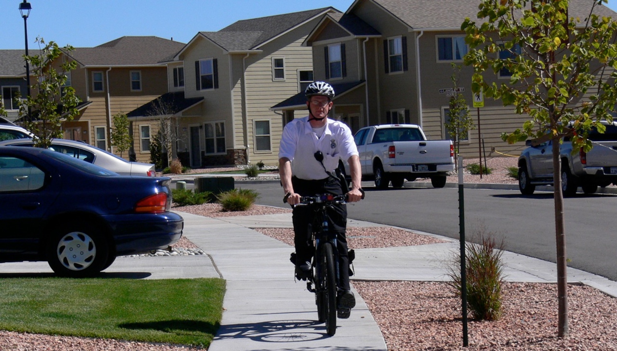 Senior Airman Derek Ables, 21st Security Forces Squadron, patrols the housing area on Peterson Air Force Base. Bicycle and ATV patrols are part of the 21st SFS policing program, which includes an increase in neighborhood patrols. Residents in violation of parking rules in the housing area will be ticketed. Anyone with questions about the parking rules go to www.peterson.tierra-vista.com and download The Resident Guide Booklet.  (U.S. Air Force photo/Monica Mendoza)
