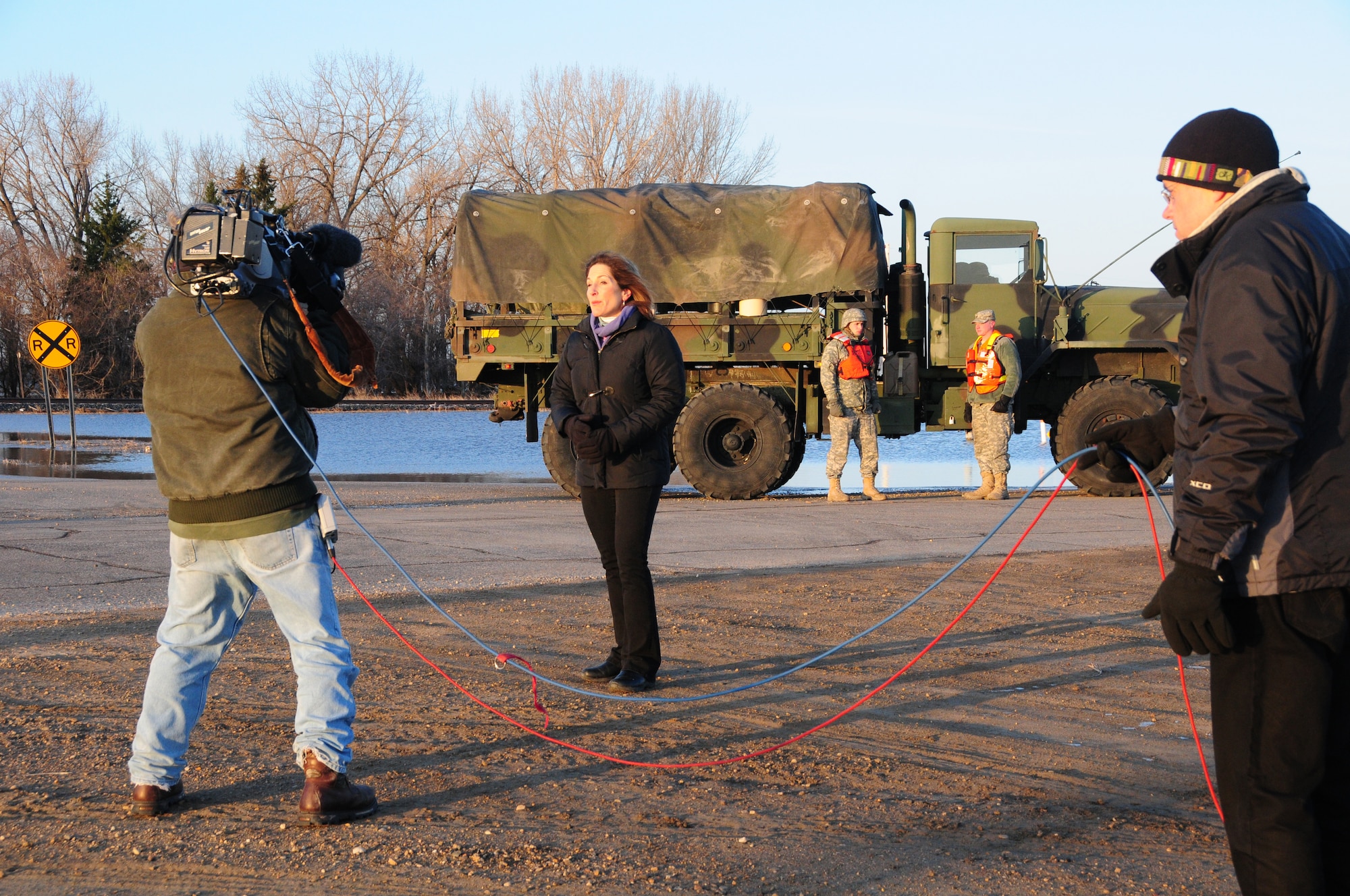 An ABC news crew films Good Morning America's story on the flooding around the city of Oslo, Minn. April 14, 2011.  From along flooded-over Minnesota Highway 1.  Barbara Pinto, a news correspondent for ABC, reported about Red River Valley flooding that has made Oslo into an island.  (U.S. Air Force photo by Tech. Sgt. Brett R. Ewald)