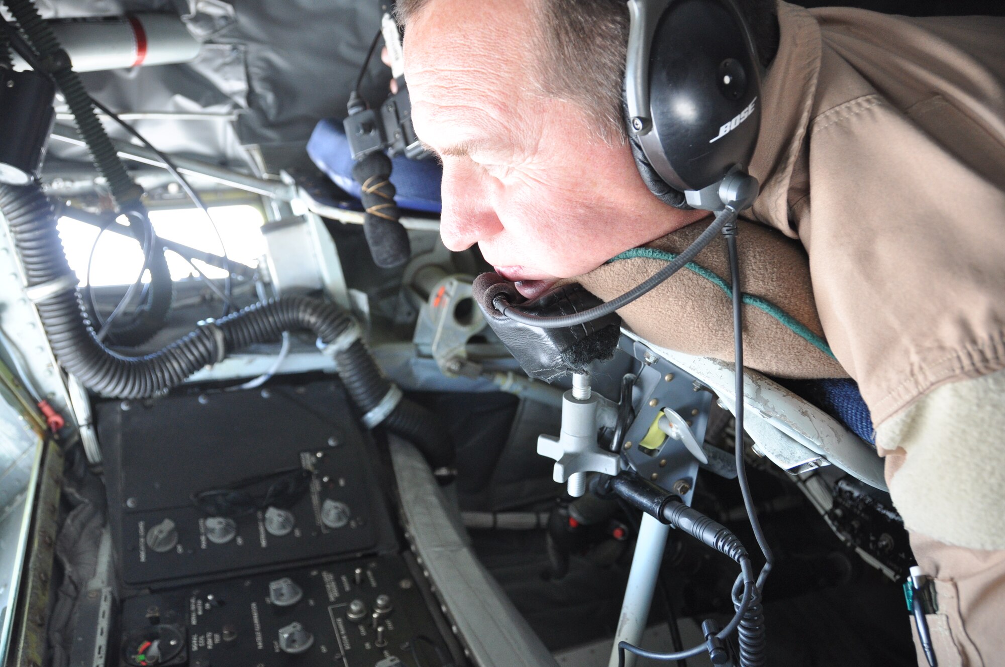 Chief Master Sgt. Brent Crozier, 340th Expeditionary Air Refueling Squadron, lowers the boom of a KC-135 for a receiver aircraft during a refueling mission over Afghanistan.  (U.S. Air Force photos/Staff Sgt. Christian Jadot)