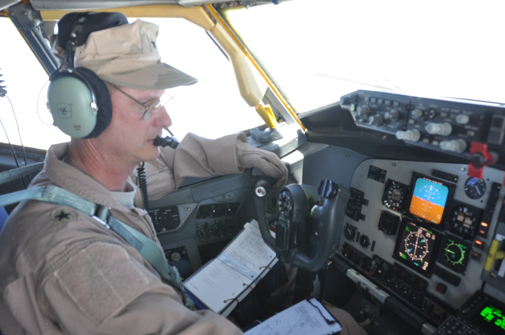Brig. General Randy Kee, 379th Air Expeditionary Wing commander, pilots a KC-135 Stratotanker during a refueling mission over Afghanistan.  (U.S. Air Force photos/Staff Sgt. Christian Jadot)