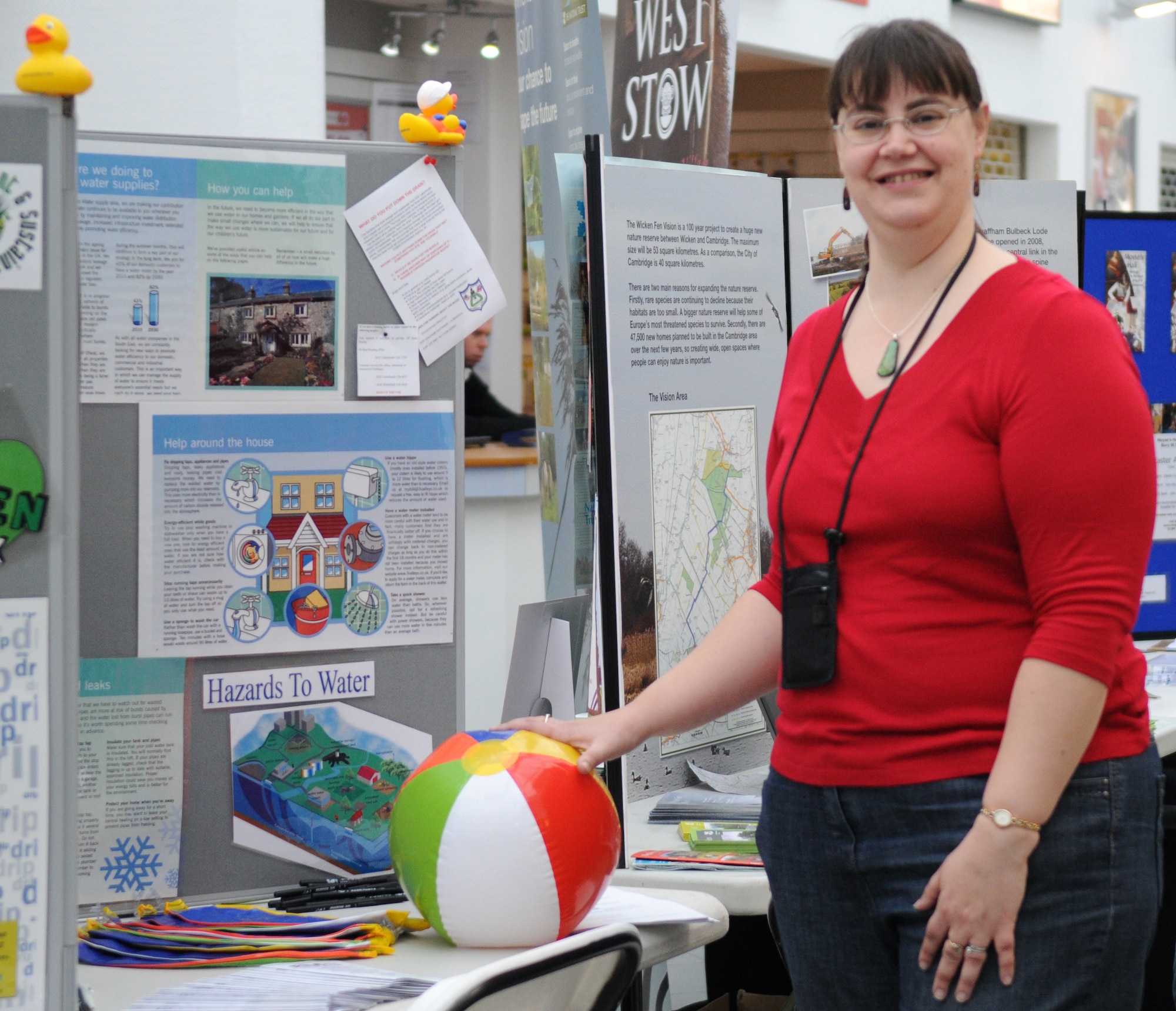 RAF MILDENHALL, England – Jo Mortimore, 48th Civil Engineer Squadron environmental, ran an information booth at the Earth Week Fair at the Exchange here April 16, 2011. Along with informational booths, the fair also had a face painting booth, quizzes for children and free educational materials. Earth Week is a week-long celebration of Earth Day between RAFs Mildenhall and Lakenheath. (U.S. Air Force photo/Airman 1st Class Rachel Waller)