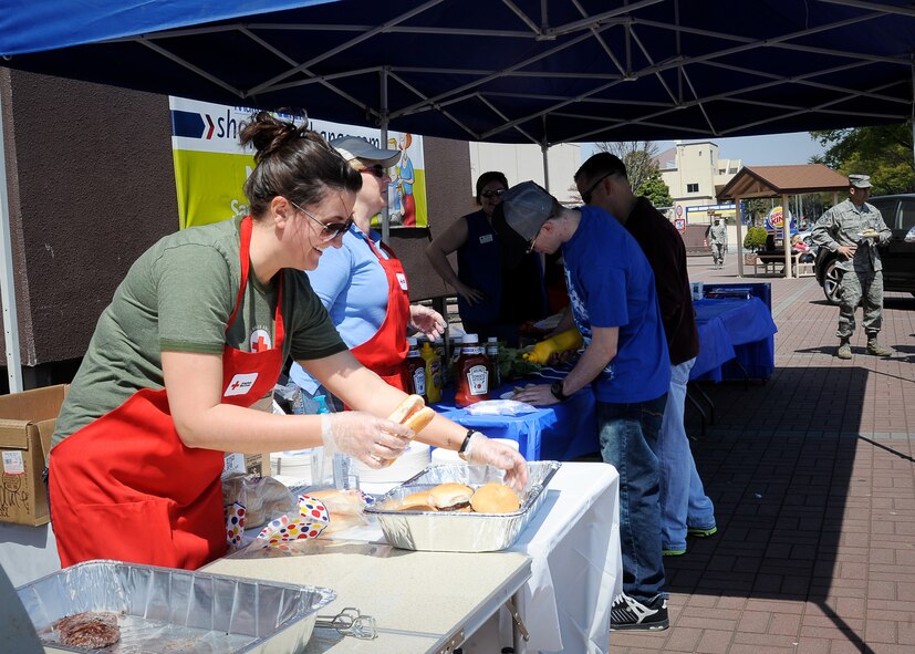 YOKOTA AIR BASE, Japan -- American Red Cross volunteers provide free lunch to Yokota members outside the Yokota Community Center here April 14, 2011. The free lunch was provided to all Yokota members in appreciation of their time, dedication and hard work since the earthquake and tsunami disaster that struck Japan, March 11. (U.S. Air Force photo/Airman 1st Class Andrea Salazar)