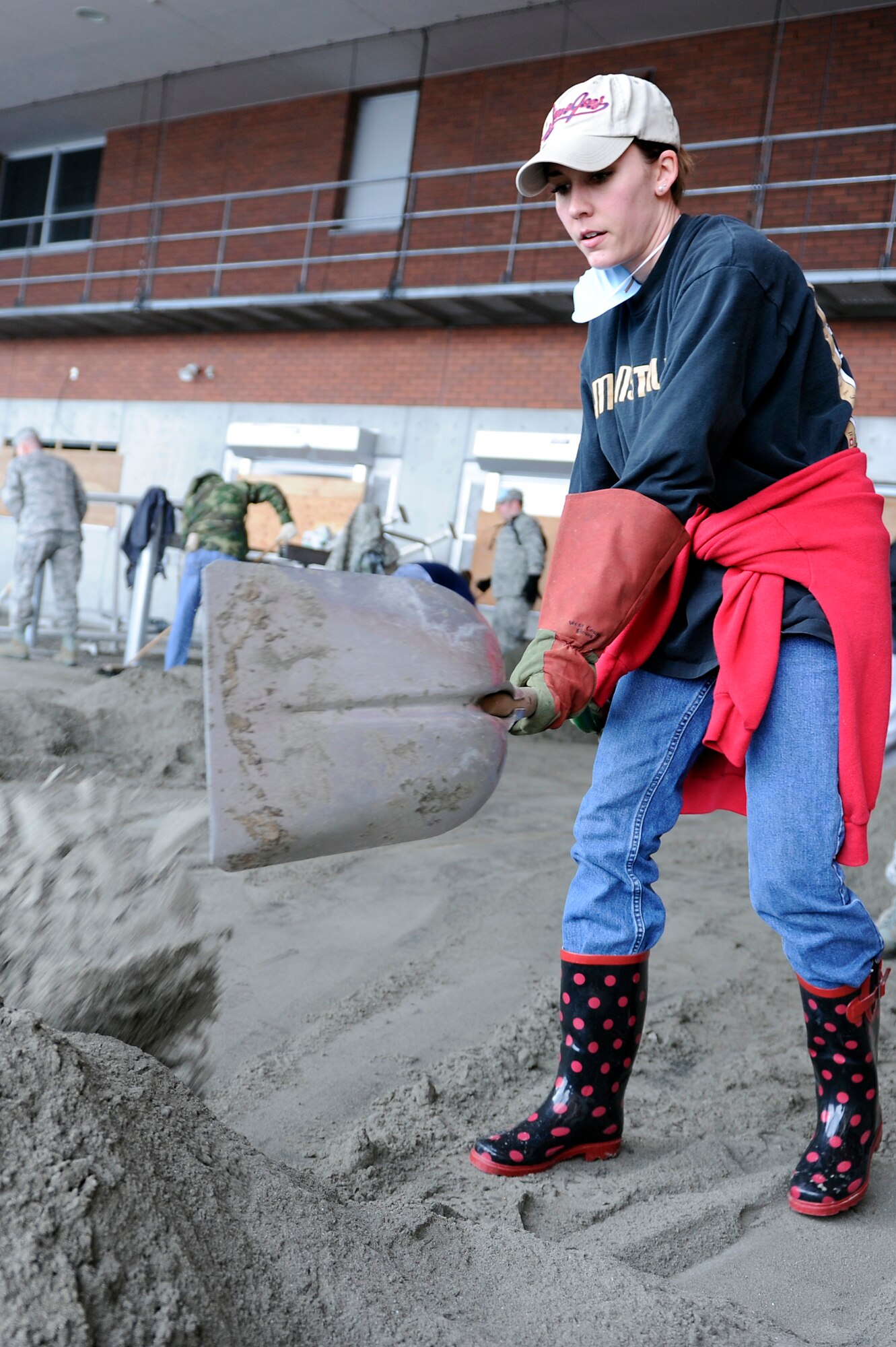 MISAWA AIR BASE, Japan -- Kerry Harding, spouse of Capt. Jeff Harding, 13th Fighter Squadron, volunteers in the local community April 16. The Misawa Helps program has been in operation for more than a month, orchestrating more than 47 clean-up missions in northern Japan. More than 2,000 volunteers have worked approximately 23,000 hours in an effort to help the Japanese communities. (U.S. Air Force photo by Staff Sgt. Marie Brown\Released)